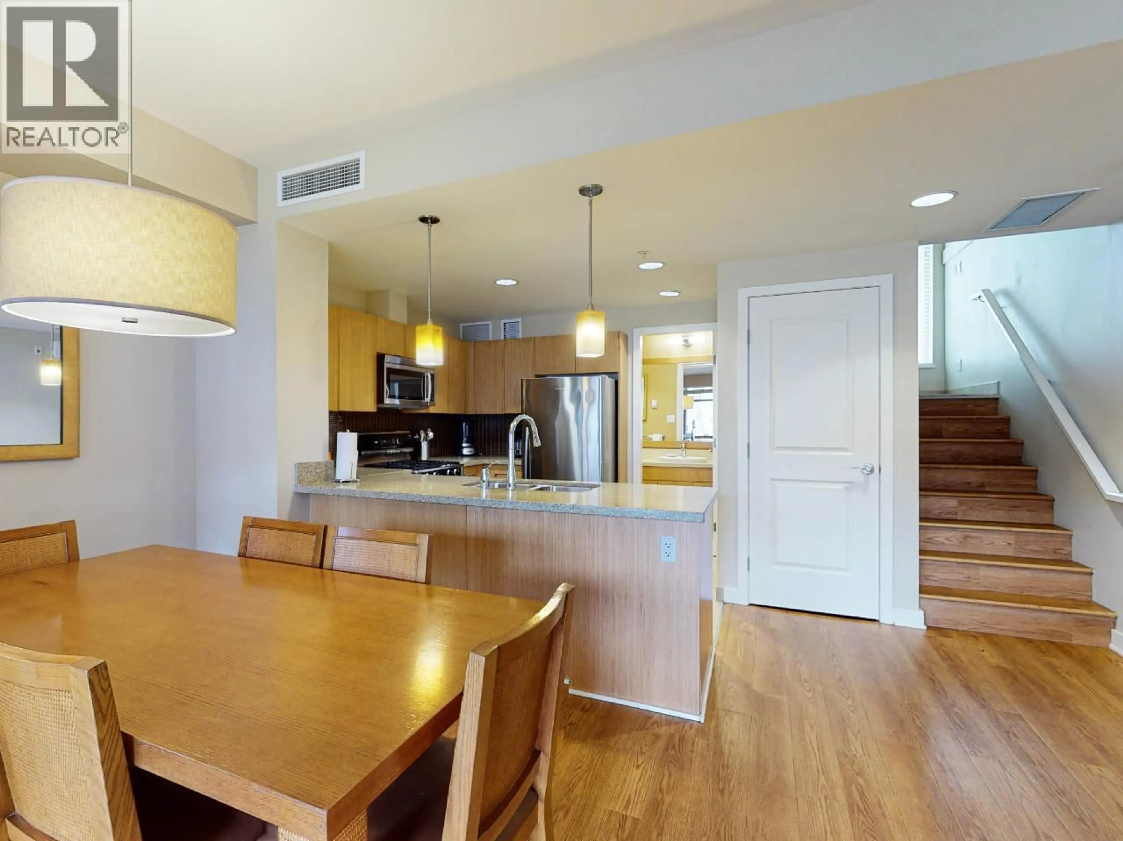 Open concept kitchen, wood/laminate floor for 14 - 15 PARK PLACE, Osoyoos British Columbia V0H1V0
