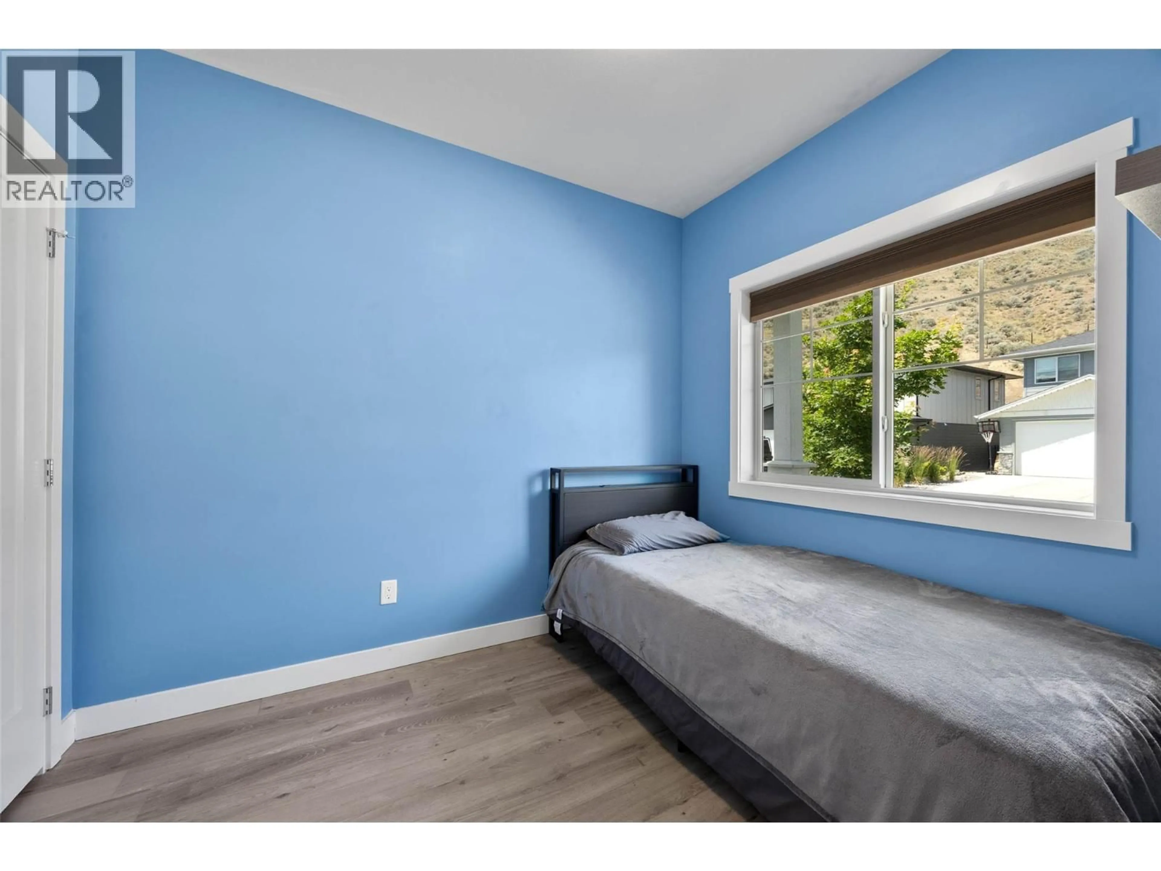 Bedroom with bed, wood/laminate floor for 23 - 1900 ORD ROAD, Kamloops British Columbia V2B0B6