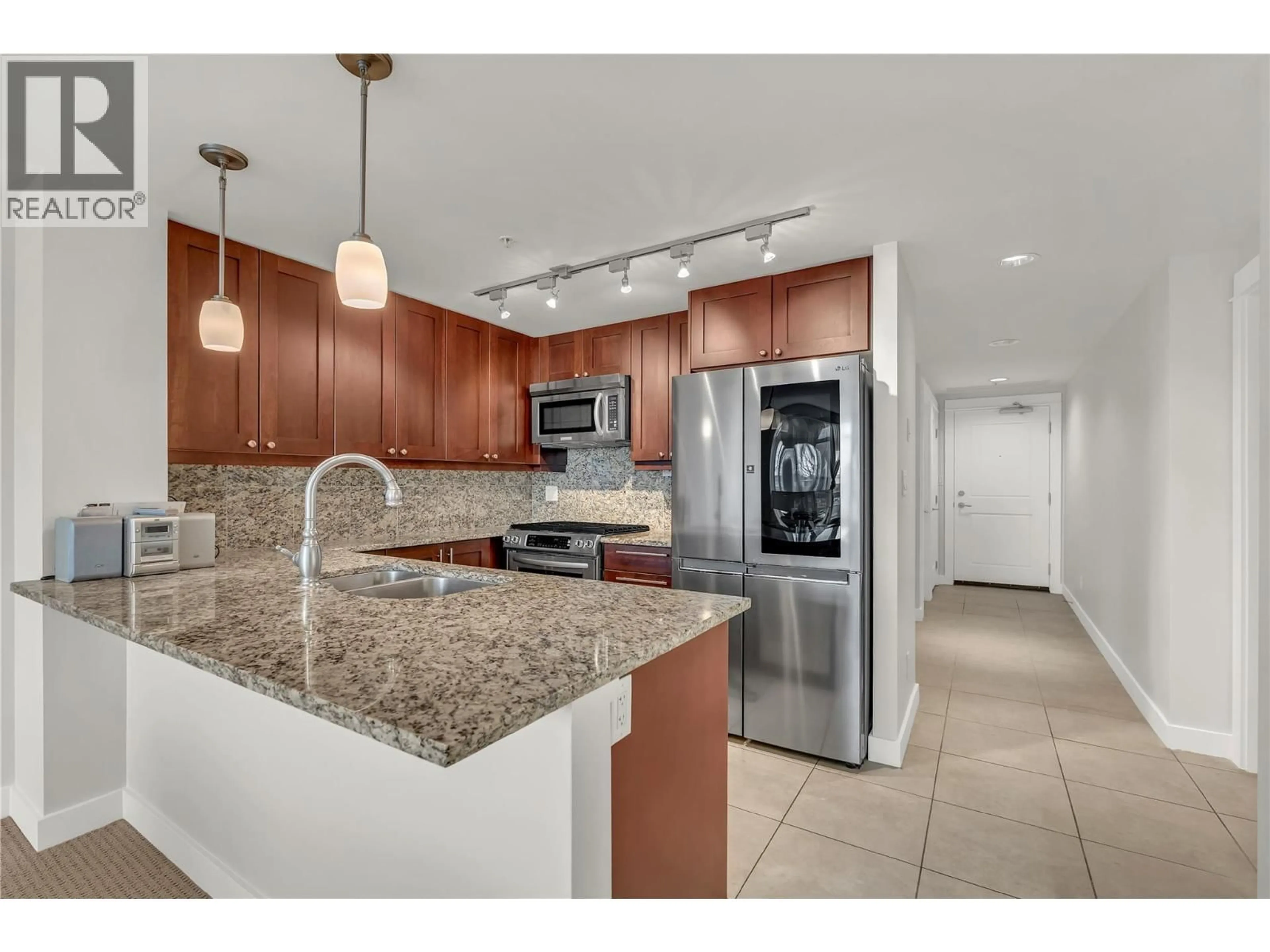 Open concept kitchen, ceramic/tile floor for 304 - 75 MARTIN STREET, Penticton British Columbia V2A9C8