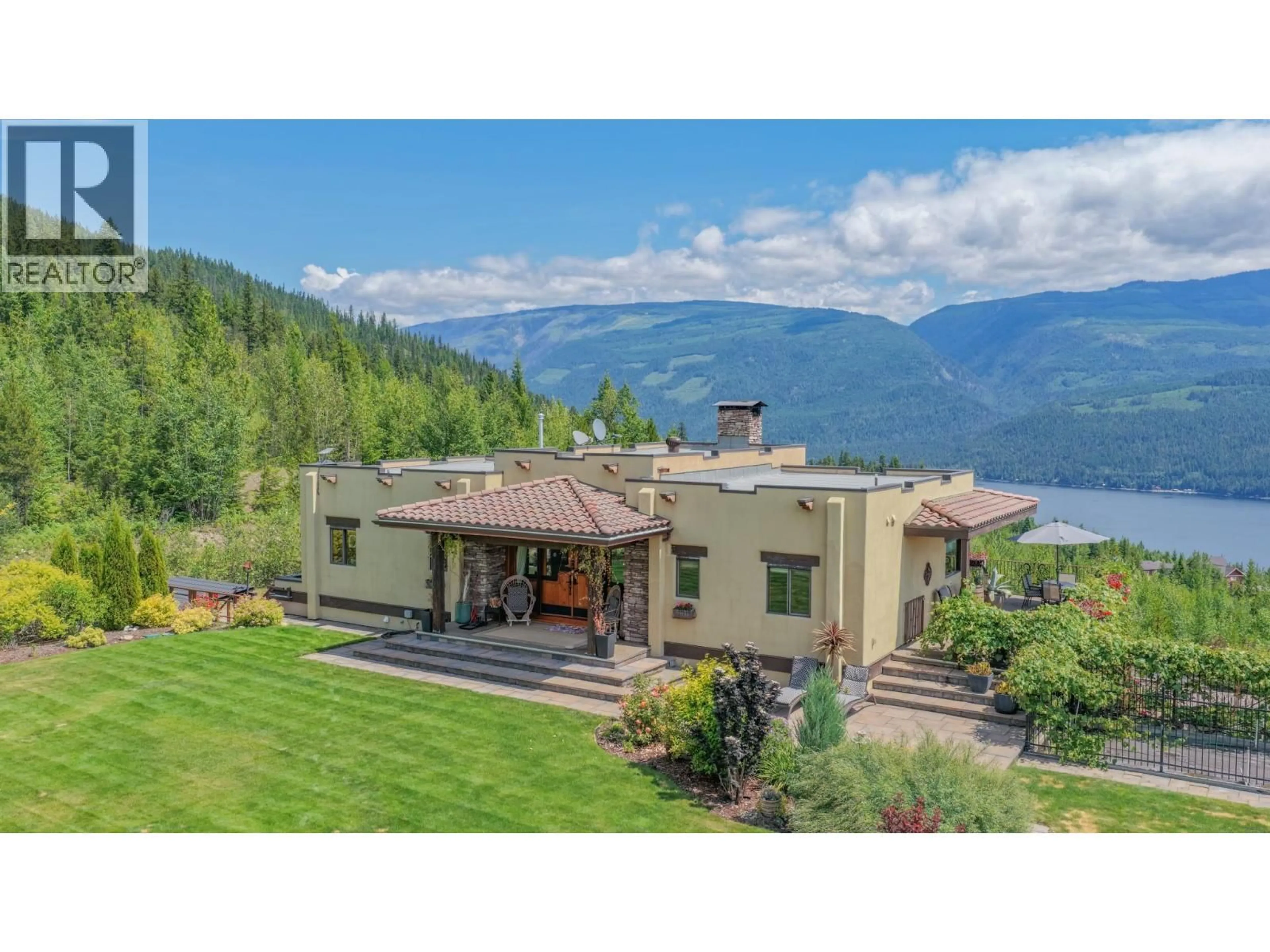 A pic from outside/outdoor area/front of a property/back of a property/a pic from drone, water/lake/river/ocean view for 1309 EAGLE RIDGE ROAD, Lumby British Columbia V0E2G4