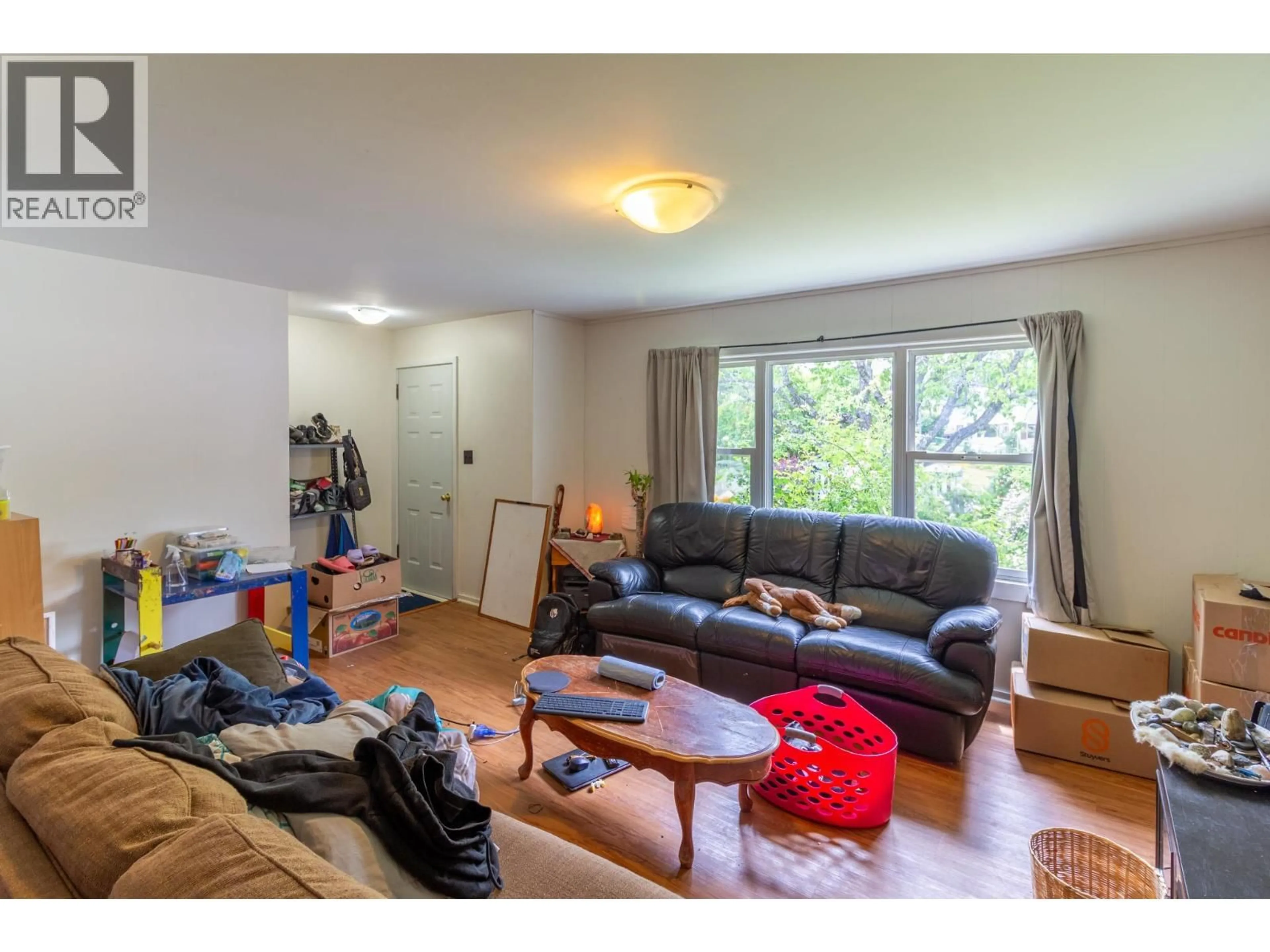 Living room with furniture, wood/laminate floor for 238 B AVENUE, Kaslo British Columbia V0G1M0
