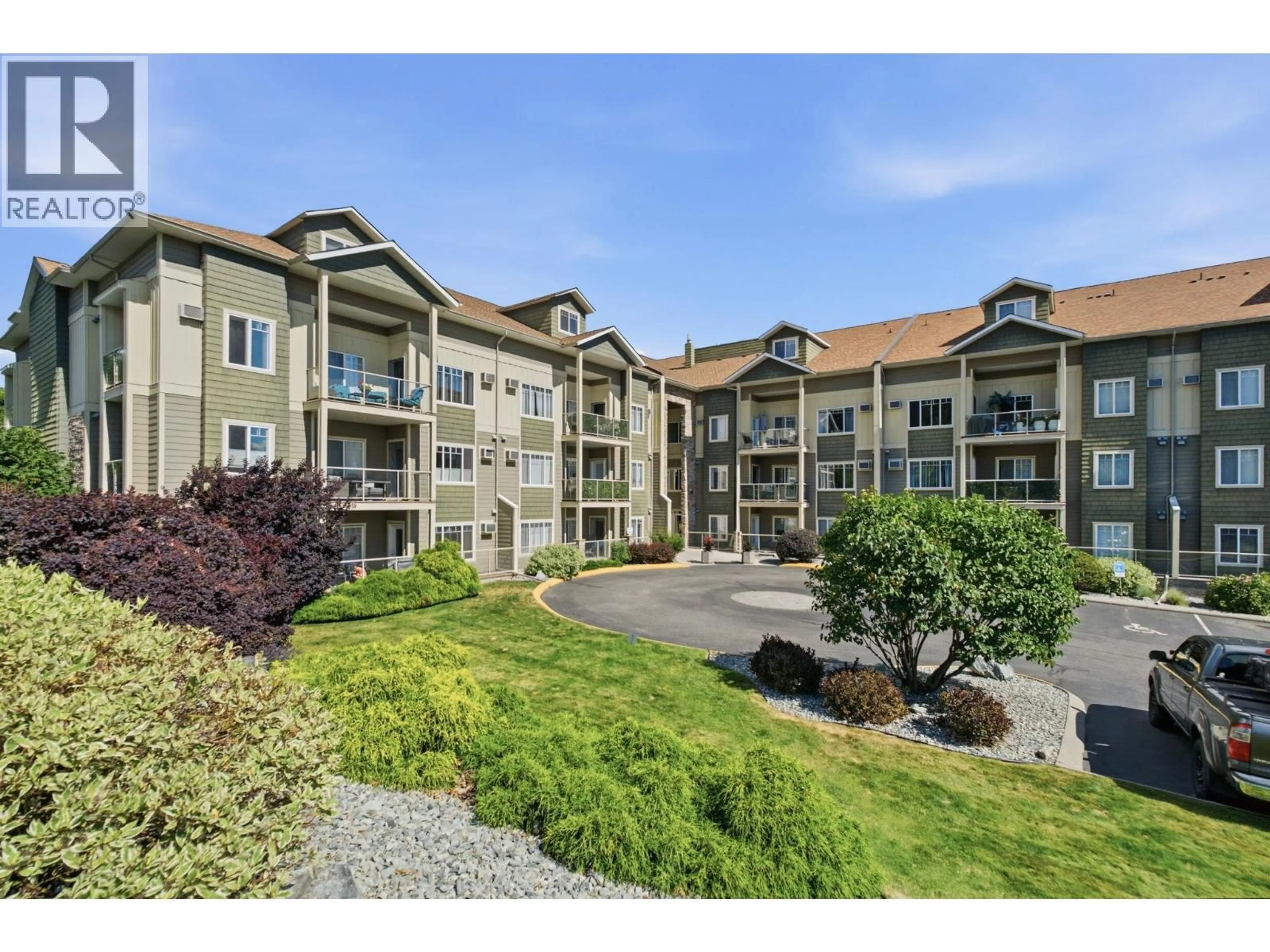 A pic from outside/outdoor area/front of a property/back of a property/a pic from drone, mountain view for 214 - 2120 SHANNON RIDGE DRIVE, West Kelowna British Columbia V4T2Z3
