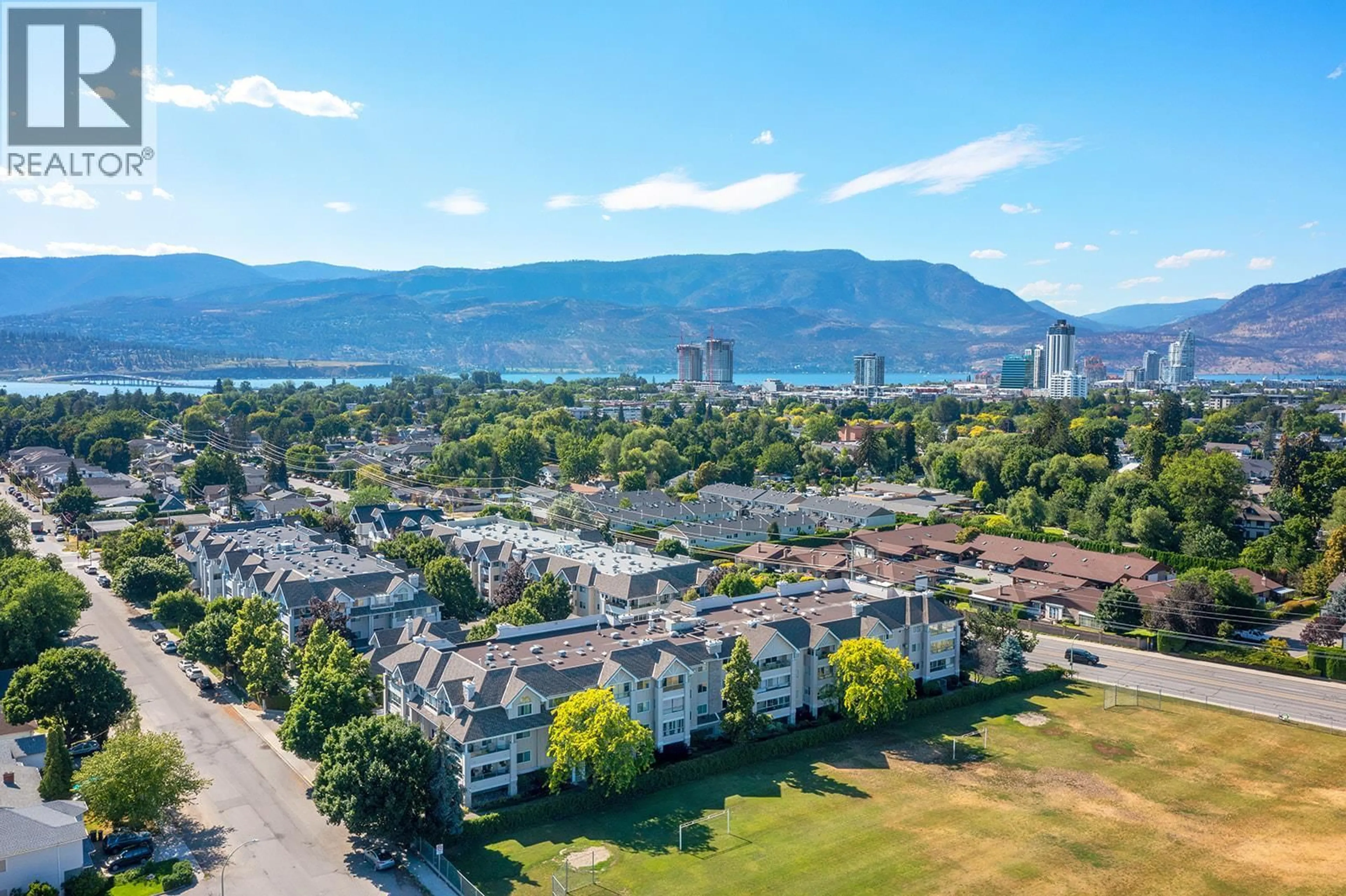 A pic from outside/outdoor area/front of a property/back of a property/a pic from drone, mountain view for 209 - 980 GLENWOOD AVENUE, Kelowna British Columbia V1Y9P2