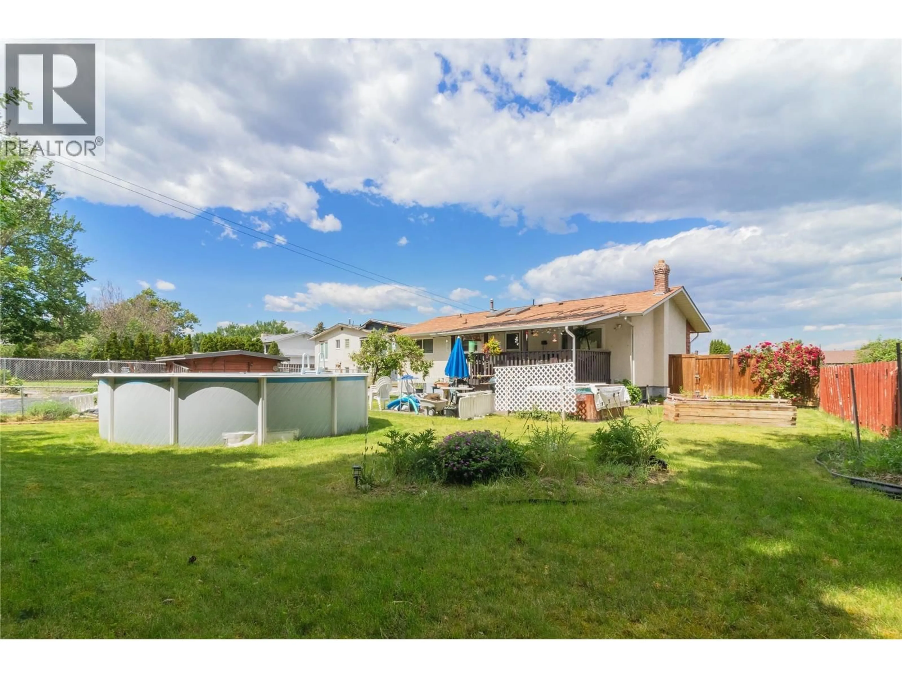 A pic from outside/outdoor area/front of a property/back of a property/a pic from drone, water/lake/river/ocean view for 215 JUPITER COURT, Kelowna British Columbia V1X5W5