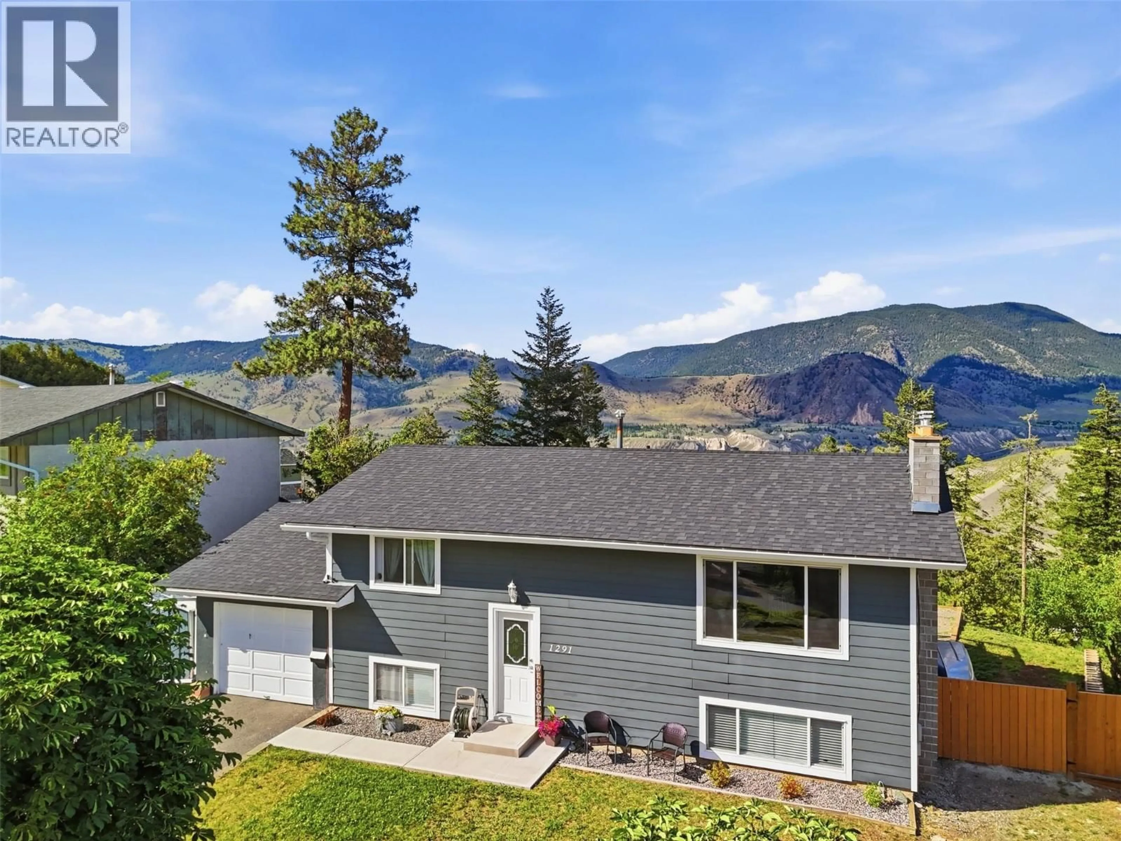 A pic from outside/outdoor area/front of a property/back of a property/a pic from drone, mountain view for 1291 HIGHRIDGE DRIVE, Kamloops British Columbia V2C5G5
