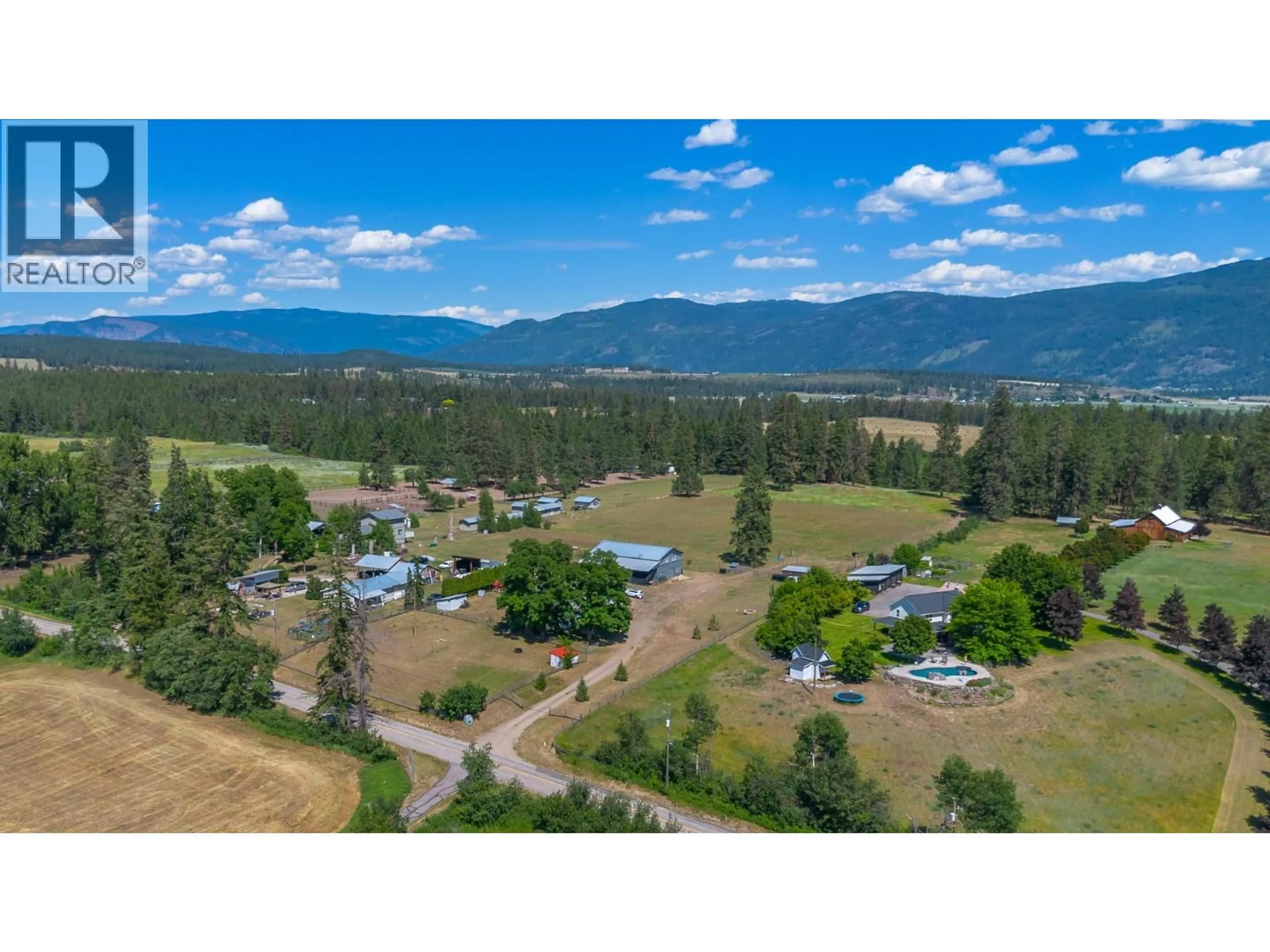 A pic from outside/outdoor area/front of a property/back of a property/a pic from drone, mountain view for 4420 SCHUBERT ROAD, Spallumcheen British Columbia V0E1B4
