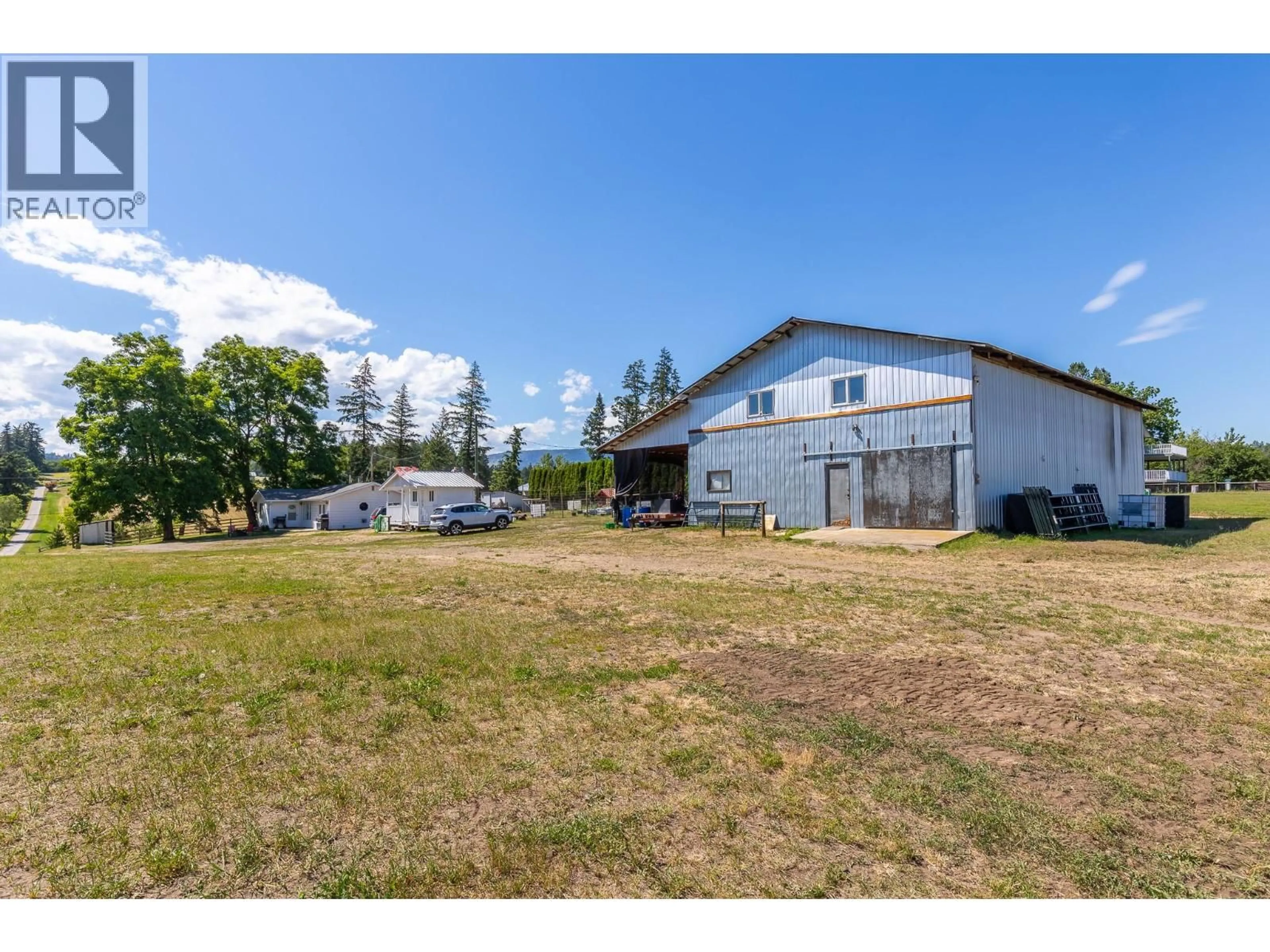 A pic from outside/outdoor area/front of a property/back of a property/a pic from drone, building for 4420 SCHUBERT ROAD, Spallumcheen British Columbia V0E1B4