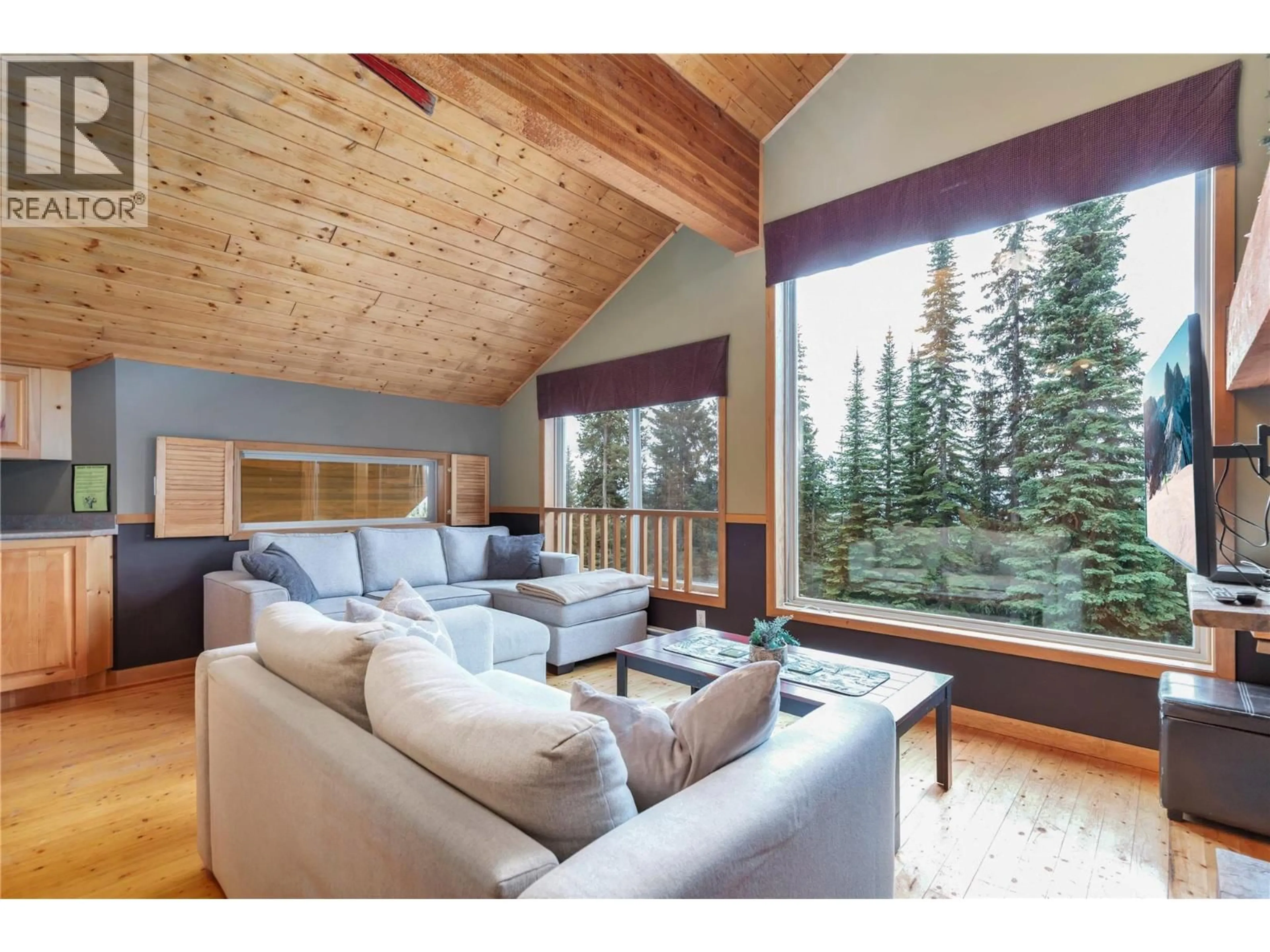Living room with furniture, wood/laminate floor for D - 4825 SNOW PINES ROAD, Big White British Columbia V0H1A0