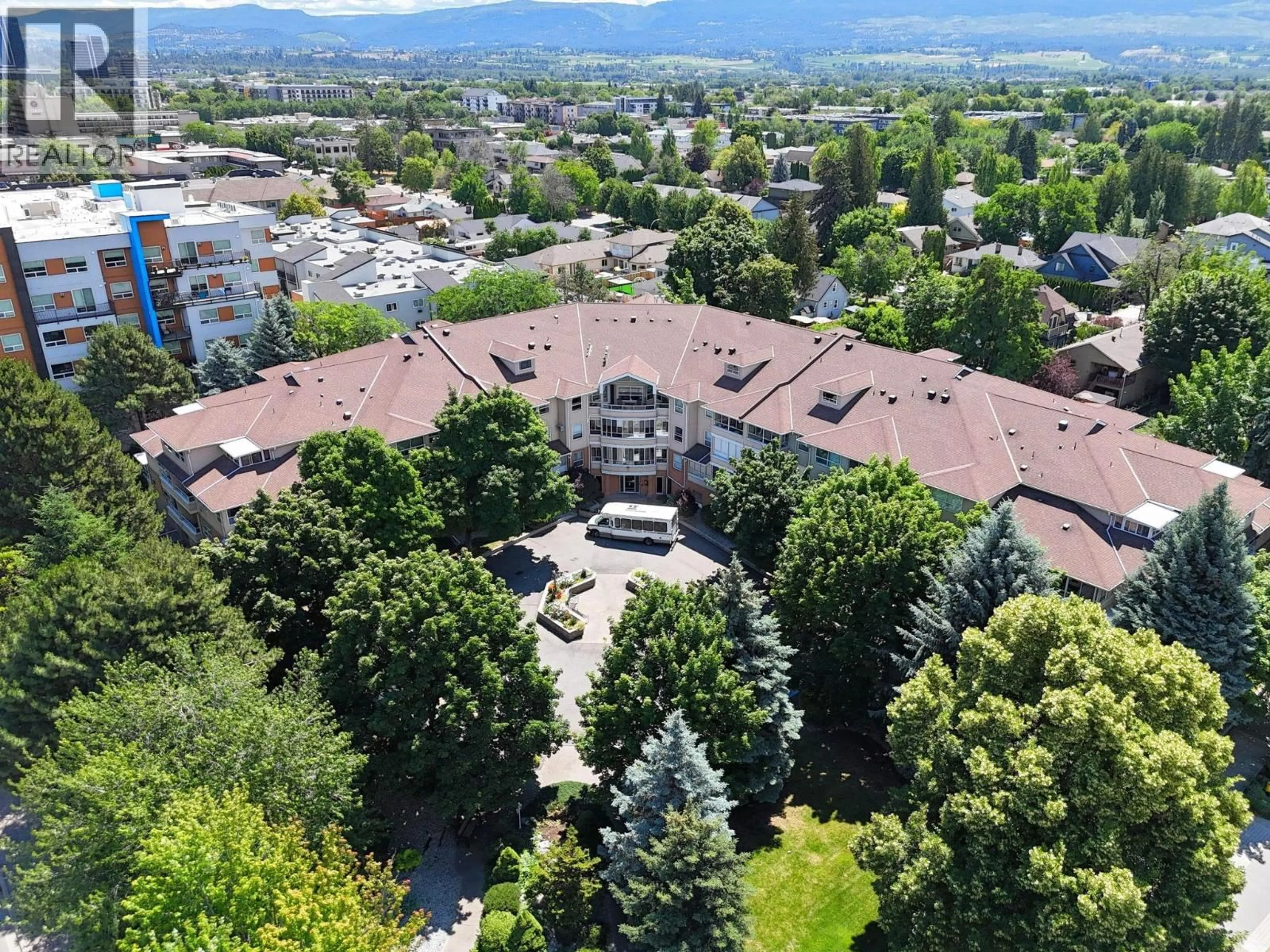 A pic from outside/outdoor area/front of a property/back of a property/a pic from drone, mountain view for 101 - 933 HARVEY AVENUE, Kelowna British Columbia V2A9S1