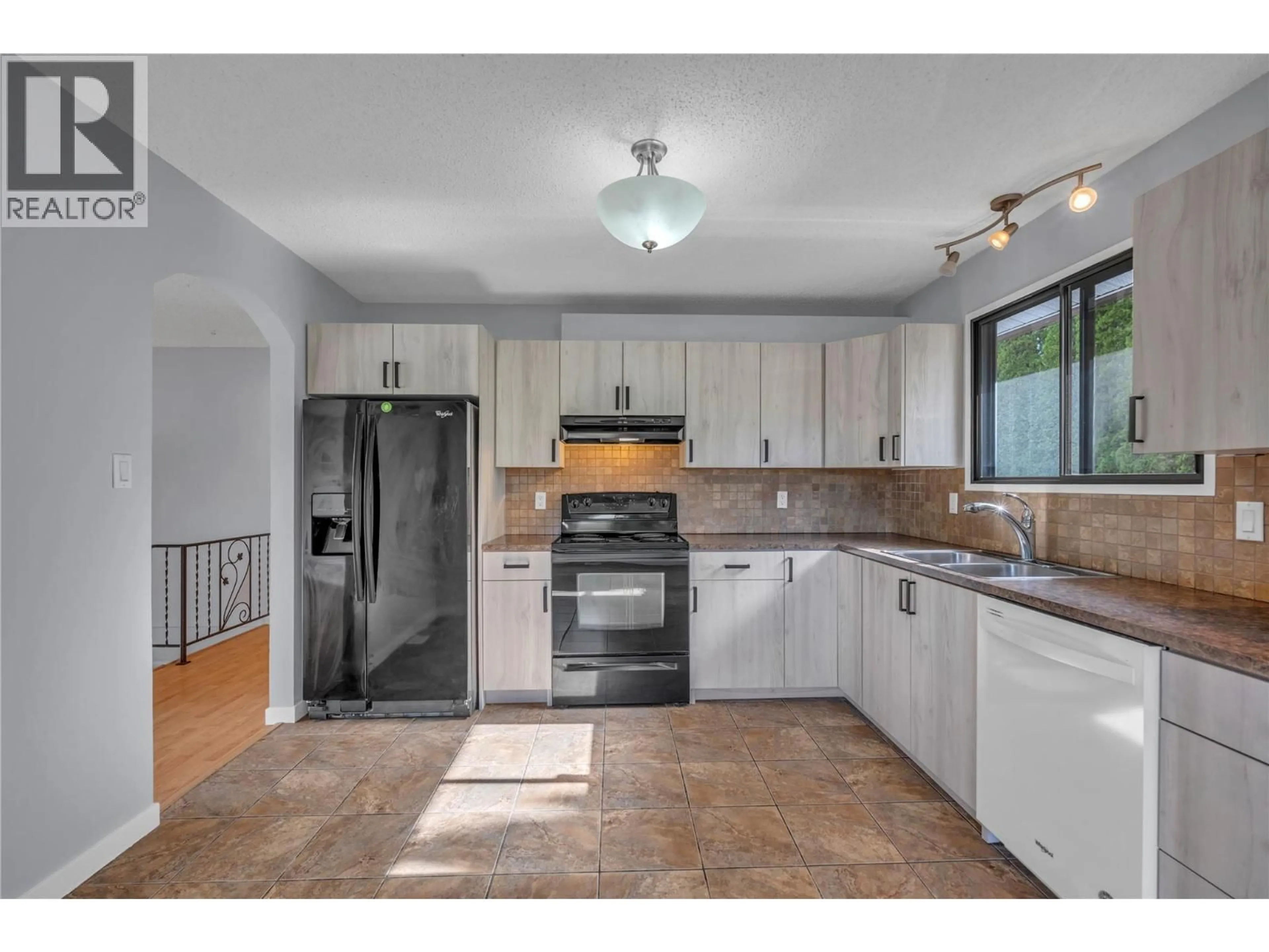 Open concept kitchen, ceramic/tile floor for 2550 WILTSE DRIVE, Penticton British Columbia V2A7X5