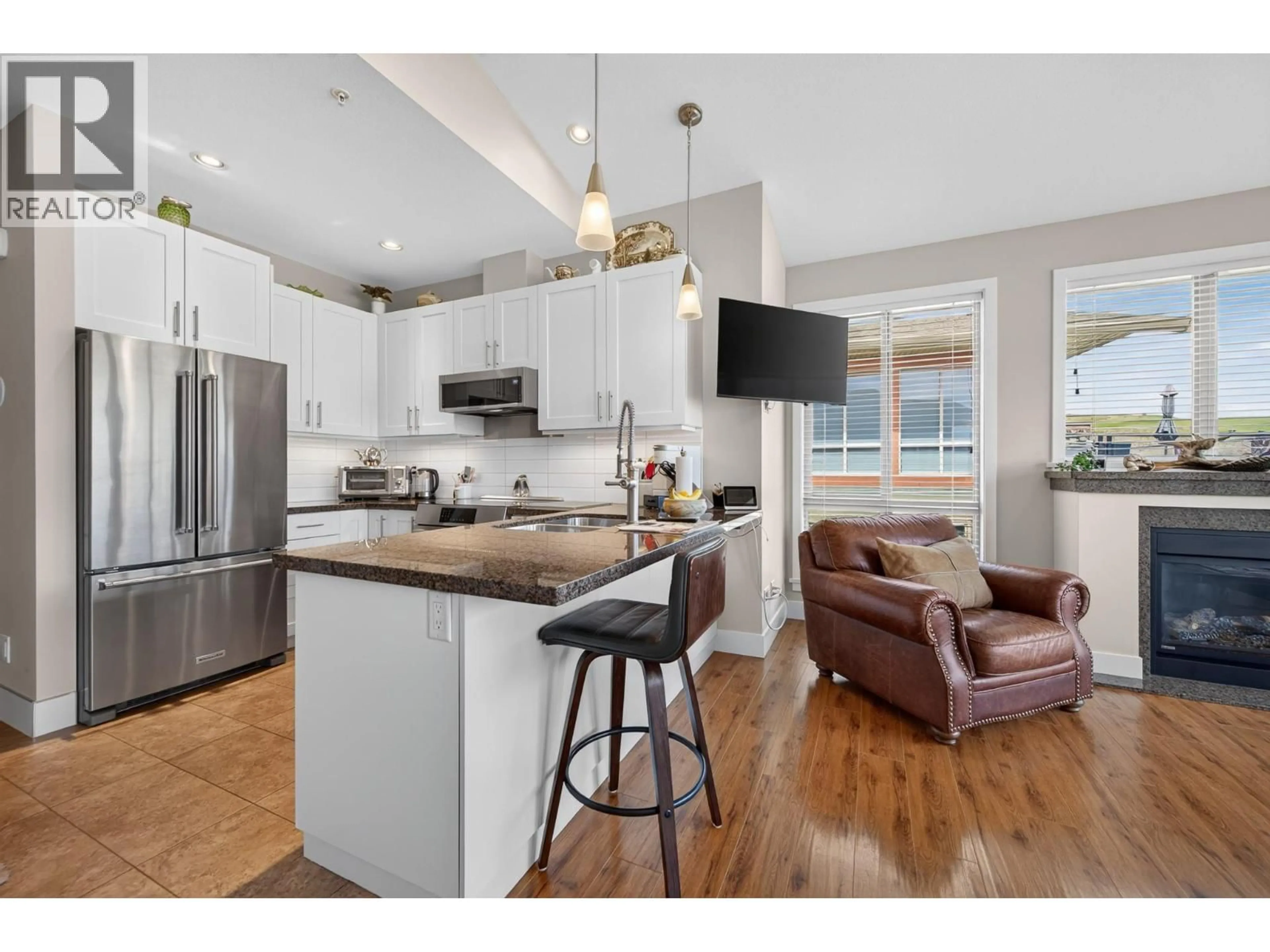 Open concept kitchen, wood/laminate floor for 85 - 130 COLEBROOK ROAD, Kamloops British Columbia V1S0B4