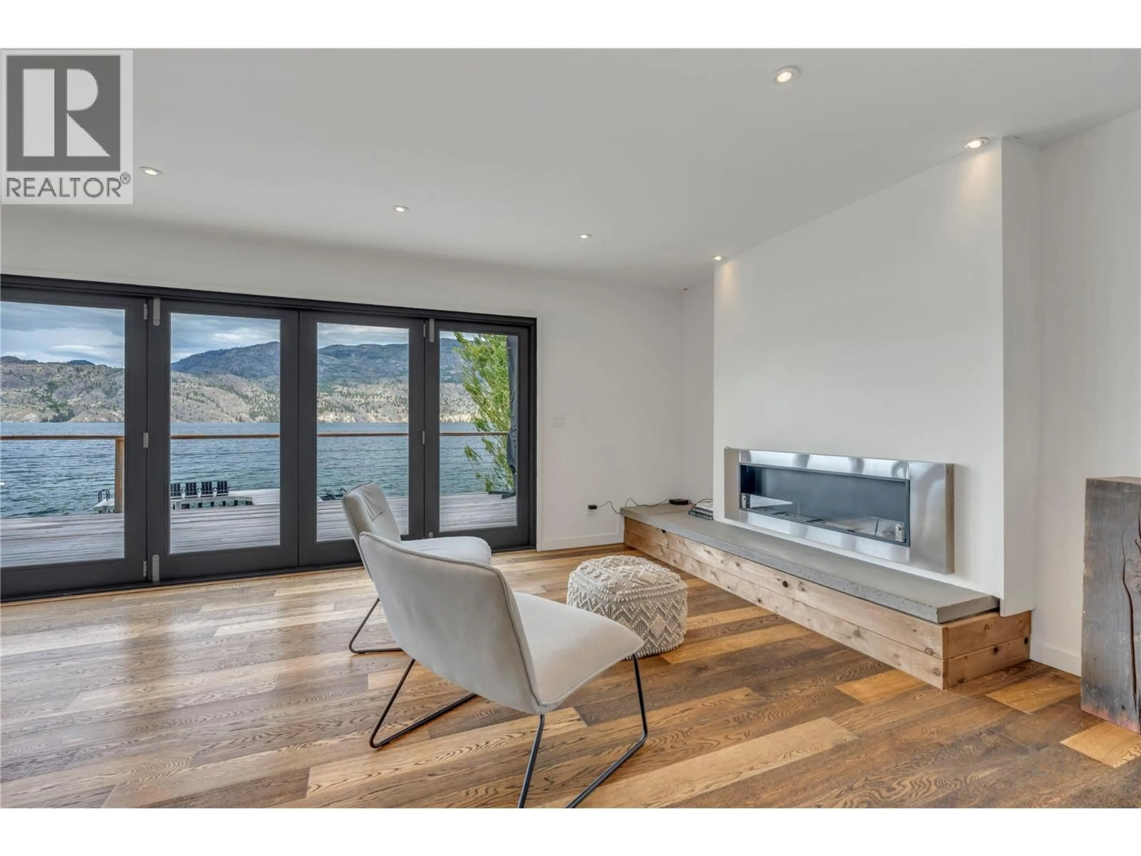 Living room with furniture, wood/laminate floor for 1 - 506 NORTH BEACH ROAD, Summerland British Columbia V0H1Z6