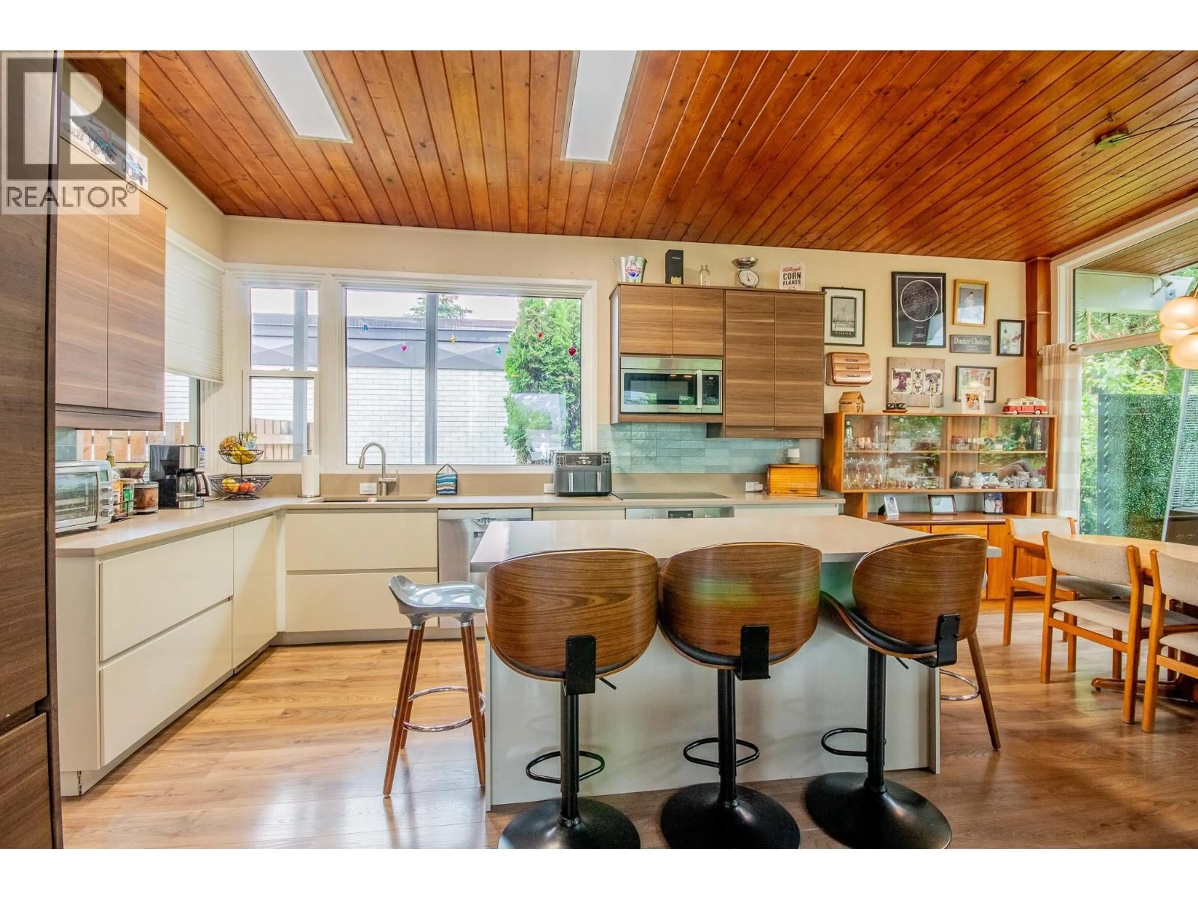 Open concept kitchen, wood/laminate floor for 9204 13 STREET, Dawson Creek British Columbia V1G3V8