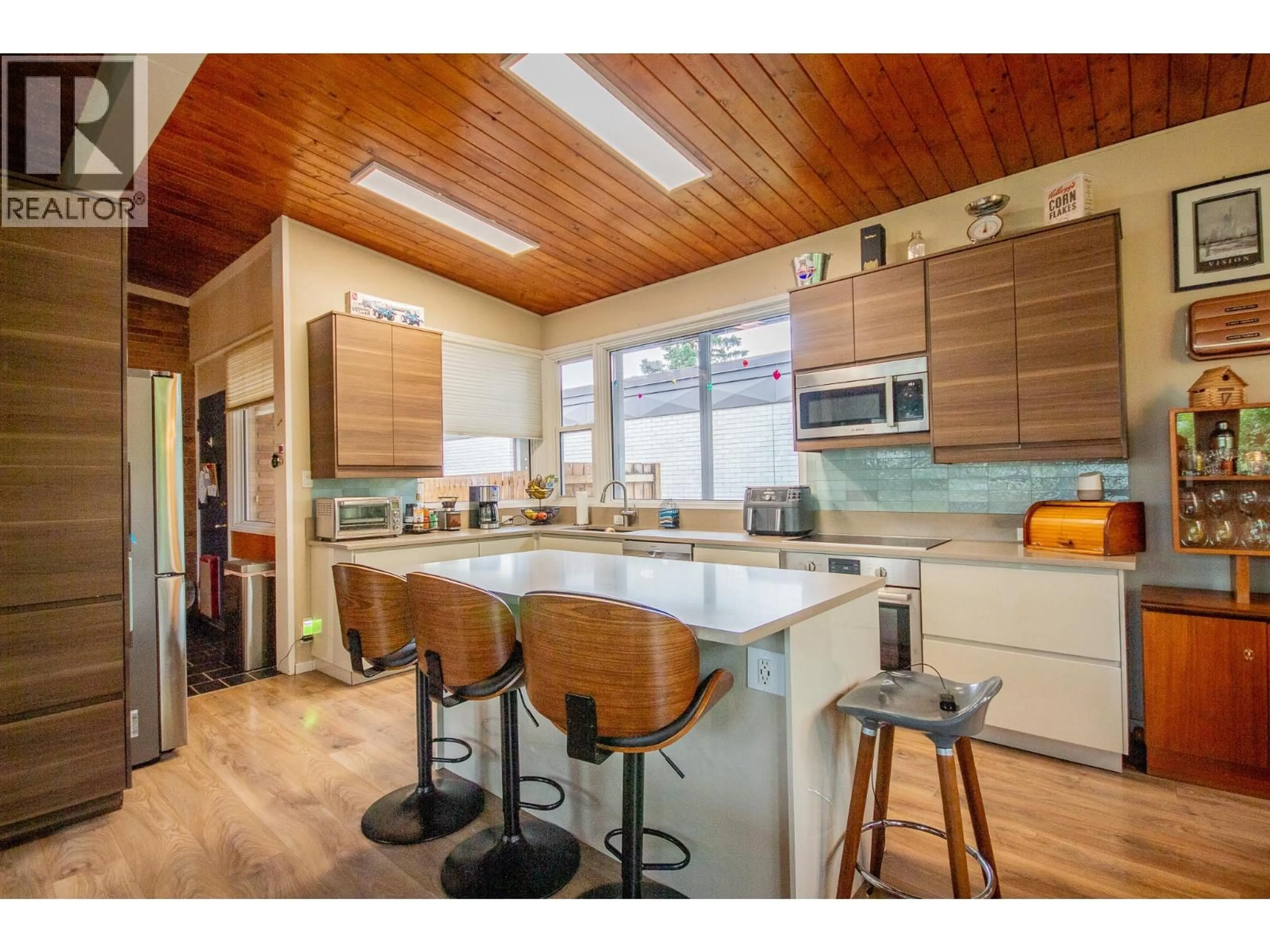Open concept kitchen, wood/laminate floor for 9204 13 STREET, Dawson Creek British Columbia V1G3V8