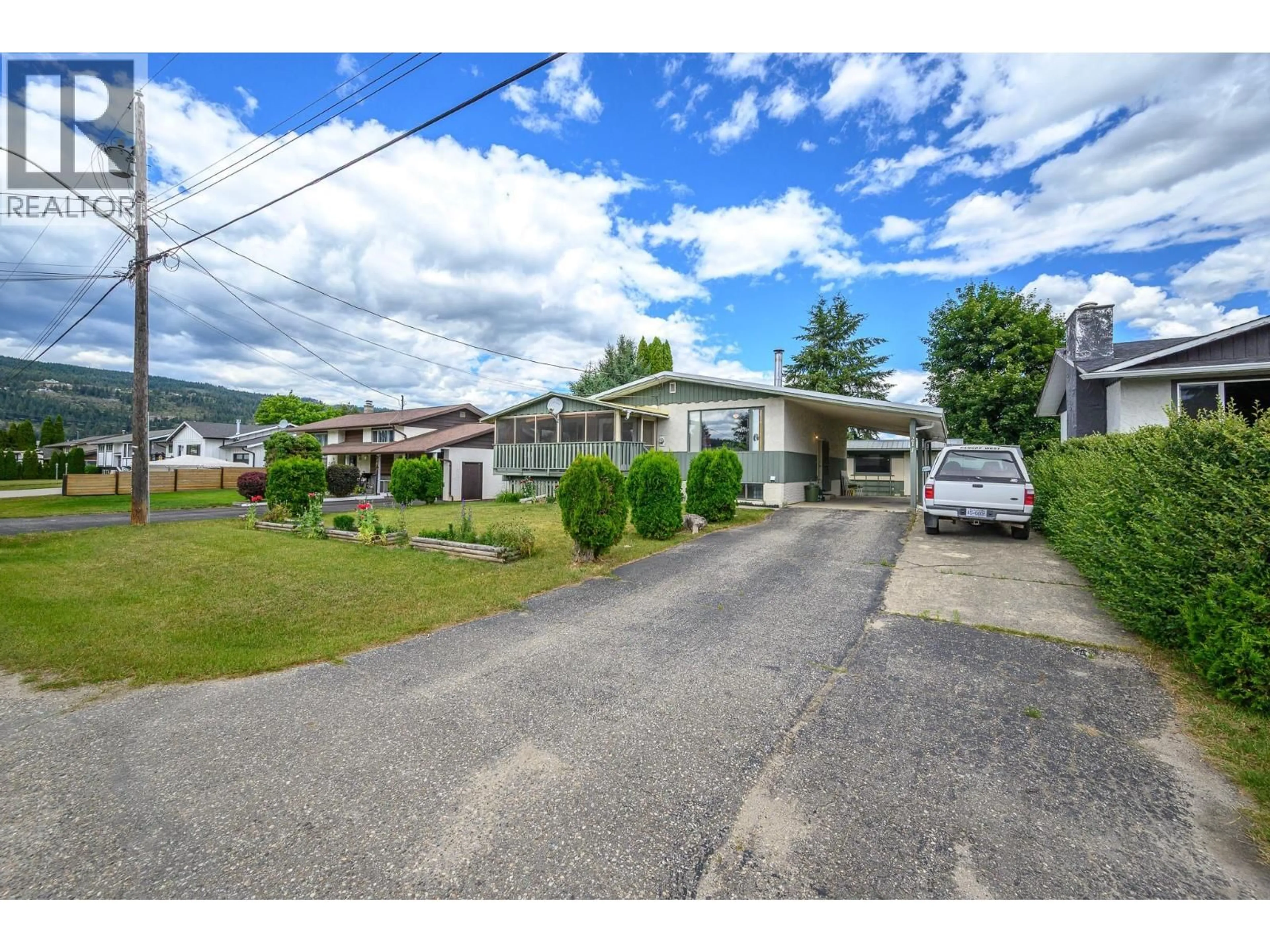 A pic from outside/outdoor area/front of a property/back of a property/a pic from drone, street for 211 LARSEN AVENUE, Enderby British Columbia V4Y4A8