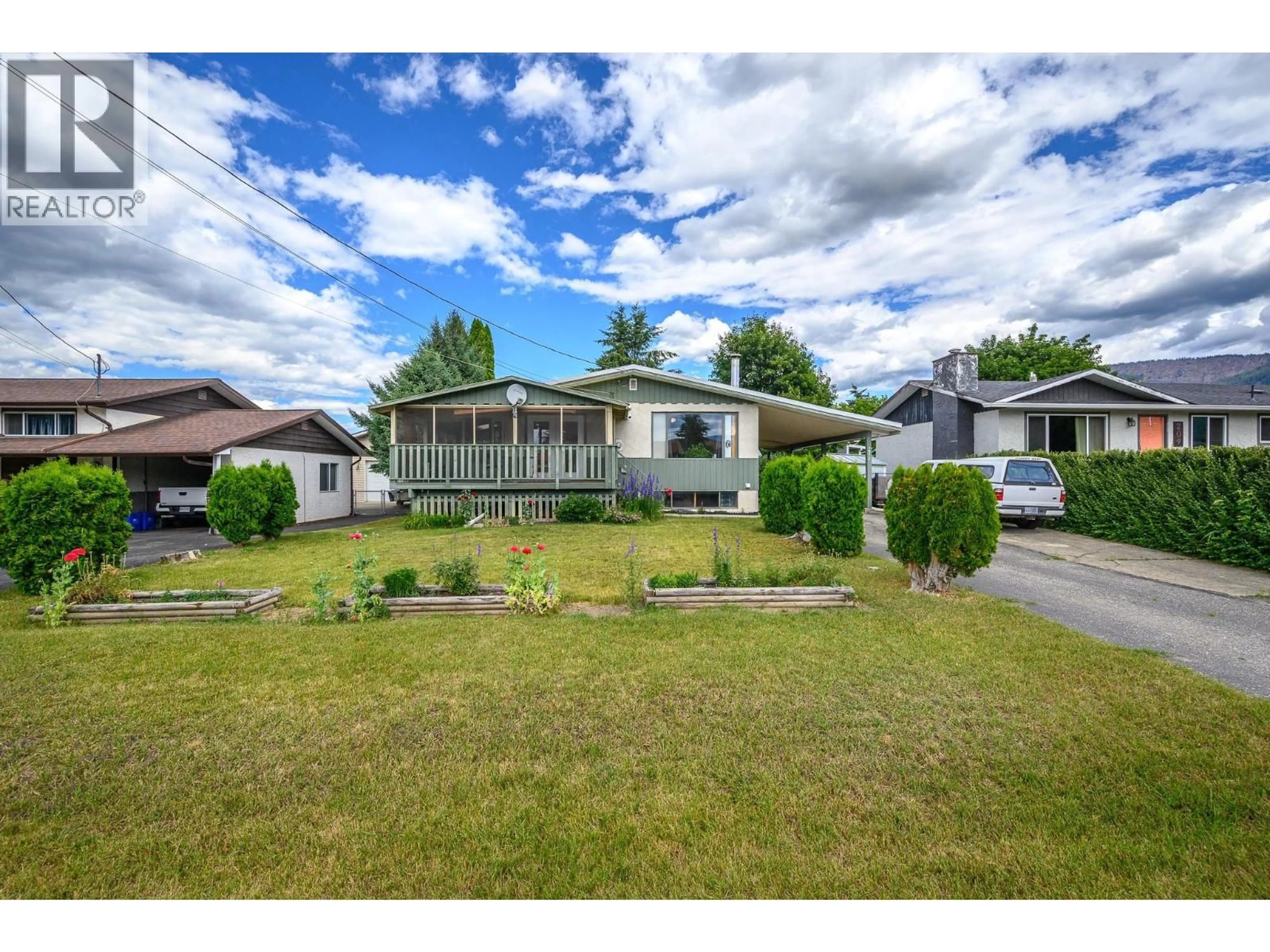 A pic from outside/outdoor area/front of a property/back of a property/a pic from drone, street for 211 LARSEN AVENUE, Enderby British Columbia V4Y4A8
