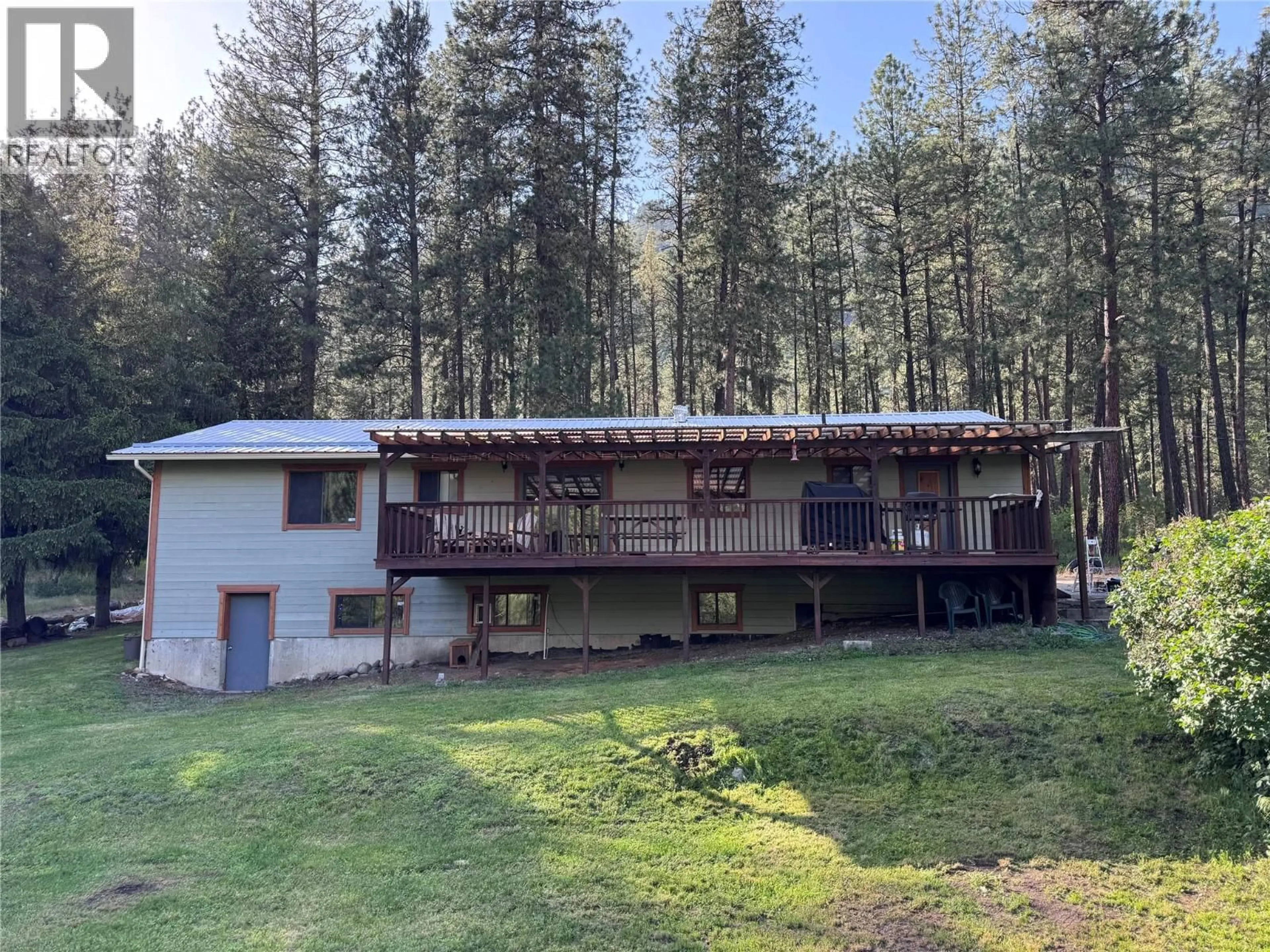 A pic from outside/outdoor area/front of a property/back of a property/a pic from drone, forest/trees view for 725 3 HIGHWAY, Cascade British Columbia V0H1E0