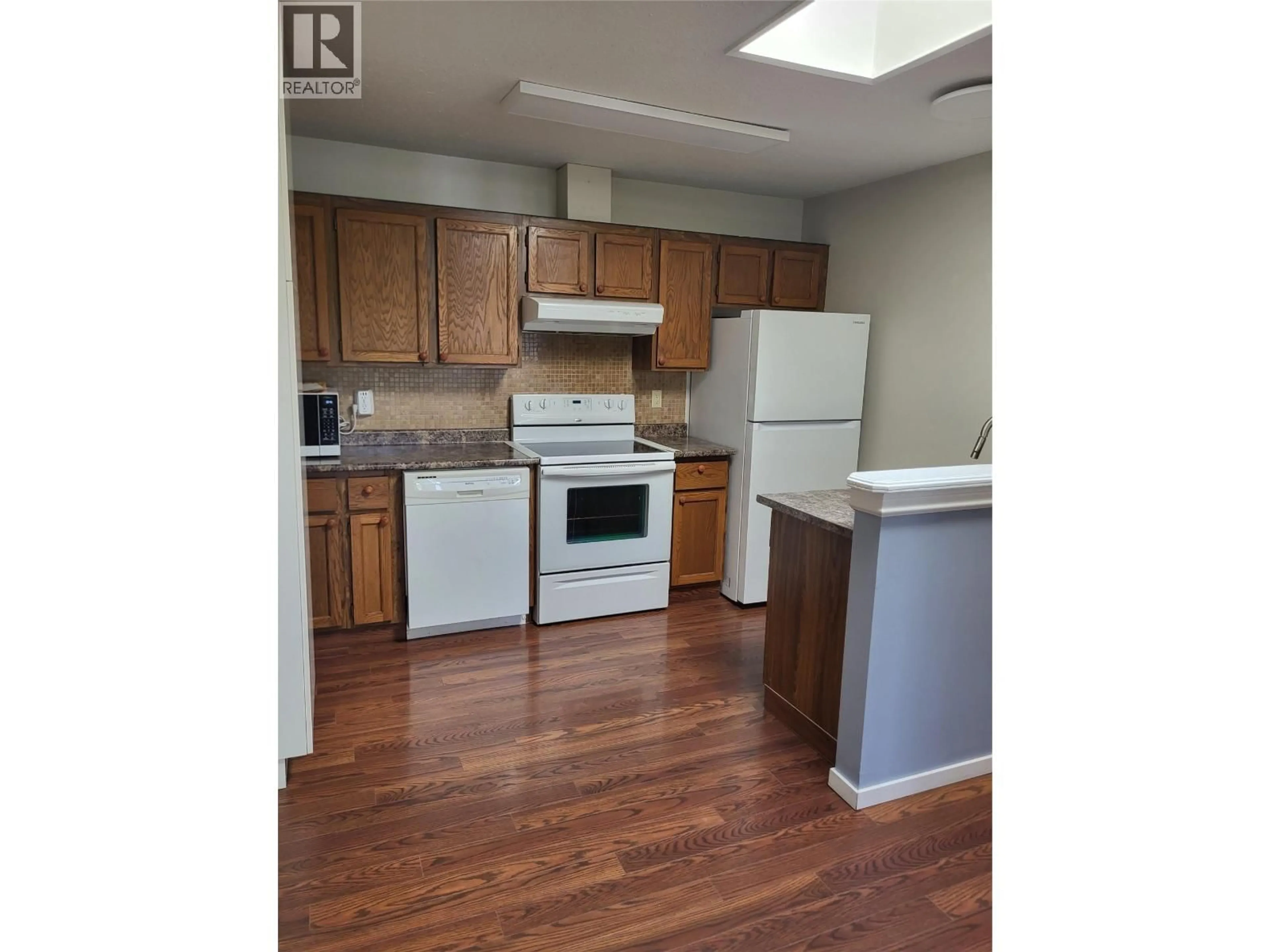Standard kitchen, wood/laminate floor for 105 - 601 WADE AVENUE WEST, Penticton British Columbia V2A1V6