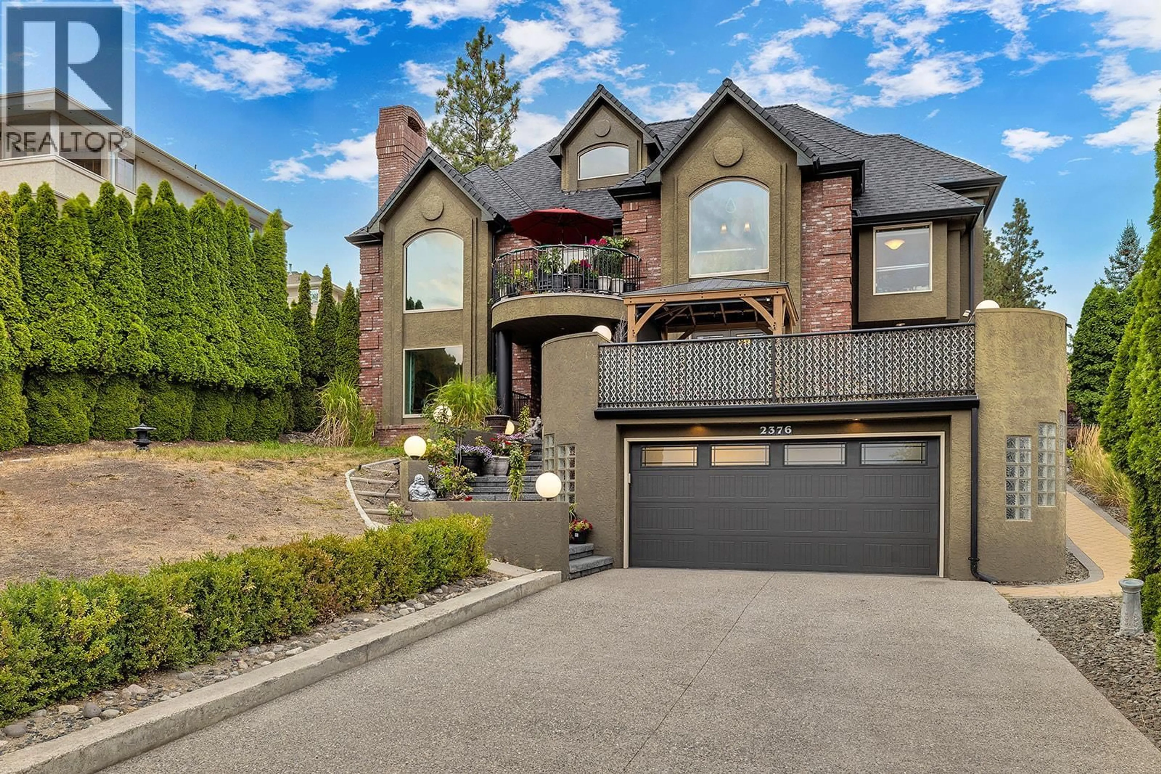 Home with brick exterior material, street for 2376 NAHANNI COURT, Kelowna British Columbia V1V1N1