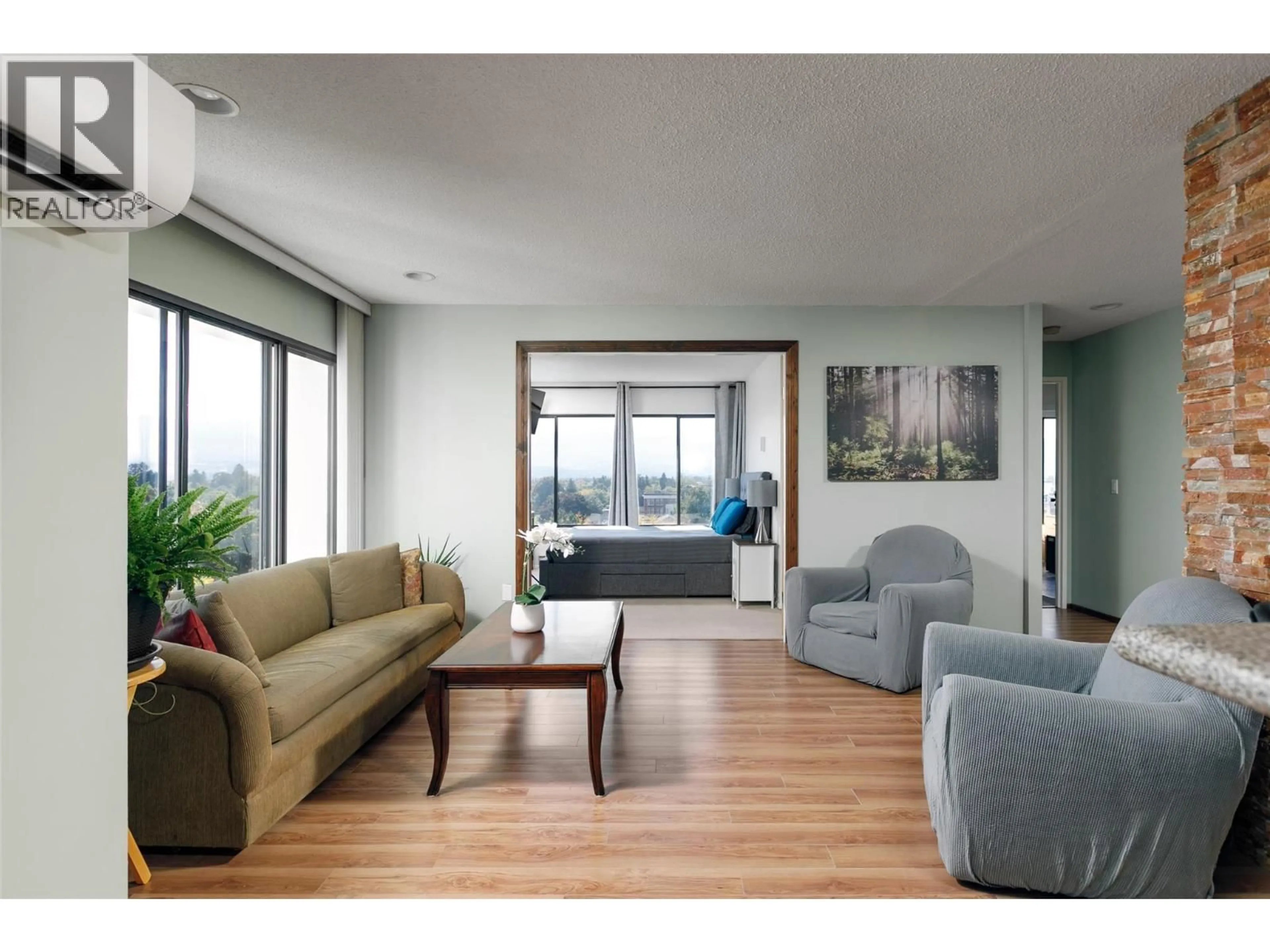 Living room with furniture, wood/laminate floor for 807 - 737 LEON AVENUE, Kelowna British Columbia V1Y8L6