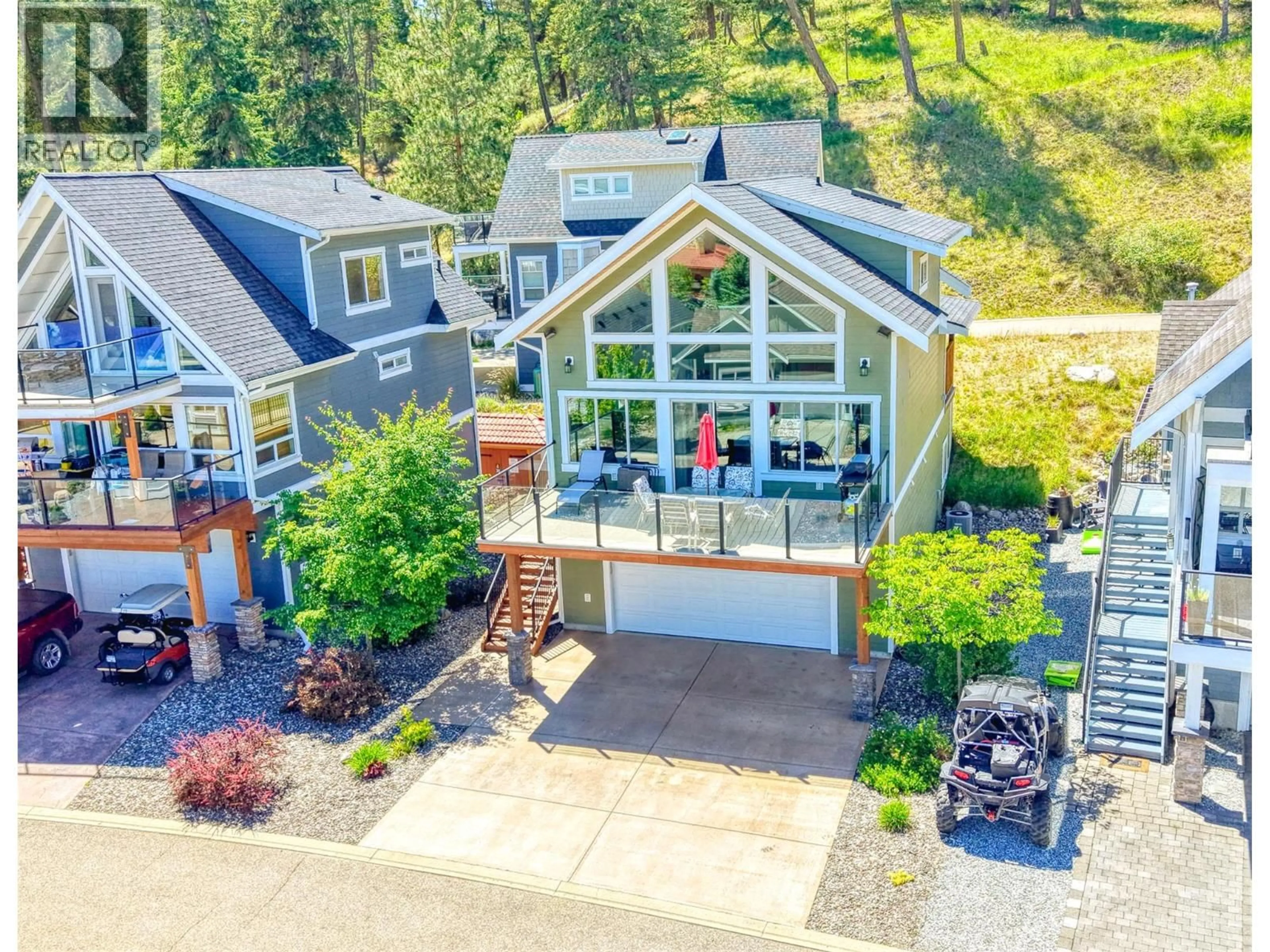 A pic from outside/outdoor area/front of a property/back of a property/a pic from drone, mountain view for 316 - 6834 MADRID WAY, Kelowna British Columbia V1Z3R8