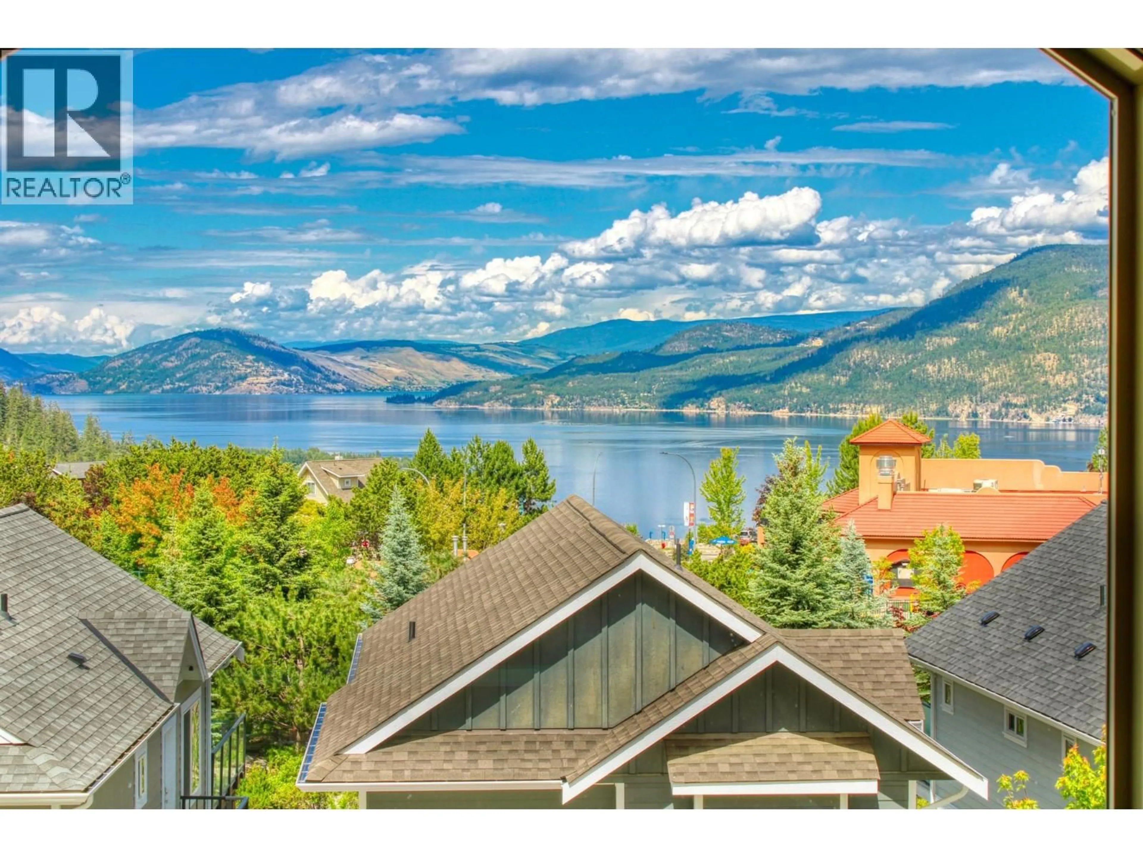 A pic from outside/outdoor area/front of a property/back of a property/a pic from drone, water/lake/river/ocean view for 316 - 6834 MADRID WAY, Kelowna British Columbia V1Z3R8