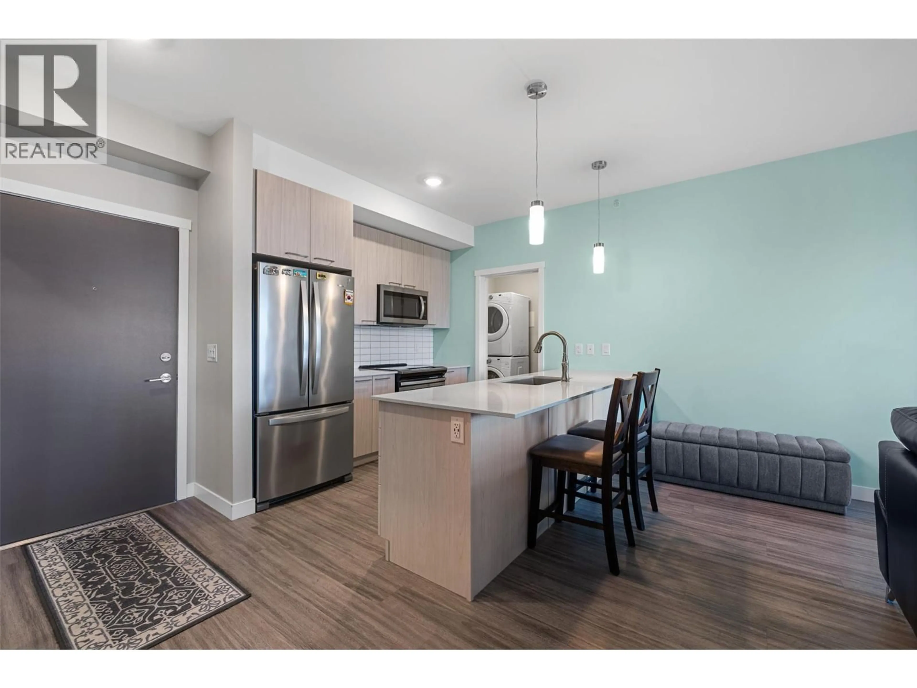 Open concept kitchen, wood/laminate floor for 403 - 2250 MAJOROS ROAD, West Kelowna British Columbia V4T0A6