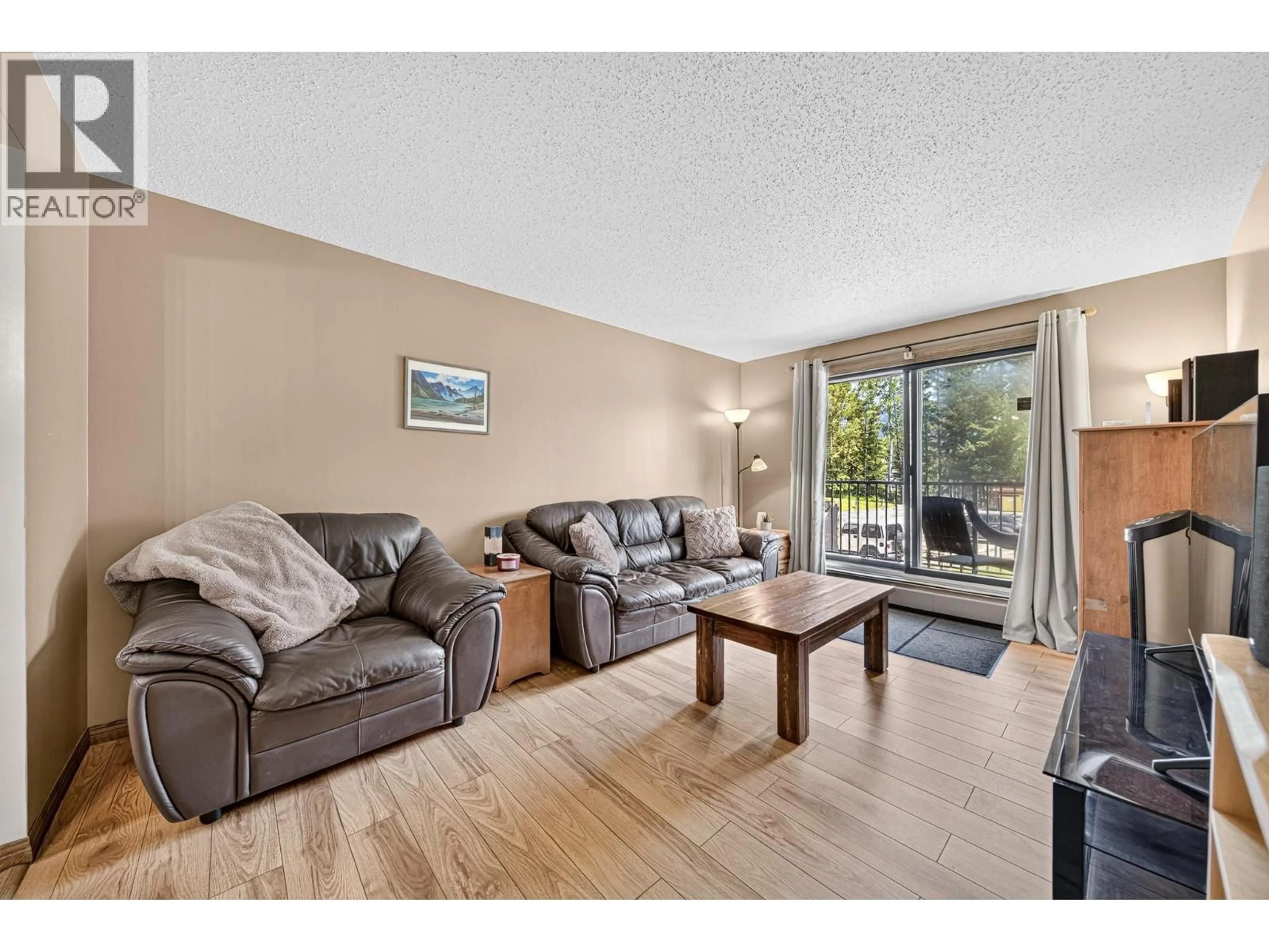 Living room with furniture, wood/laminate floor for 416 D-1286 PONDEROSA DRIVE, Sparwood British Columbia V0B2G2