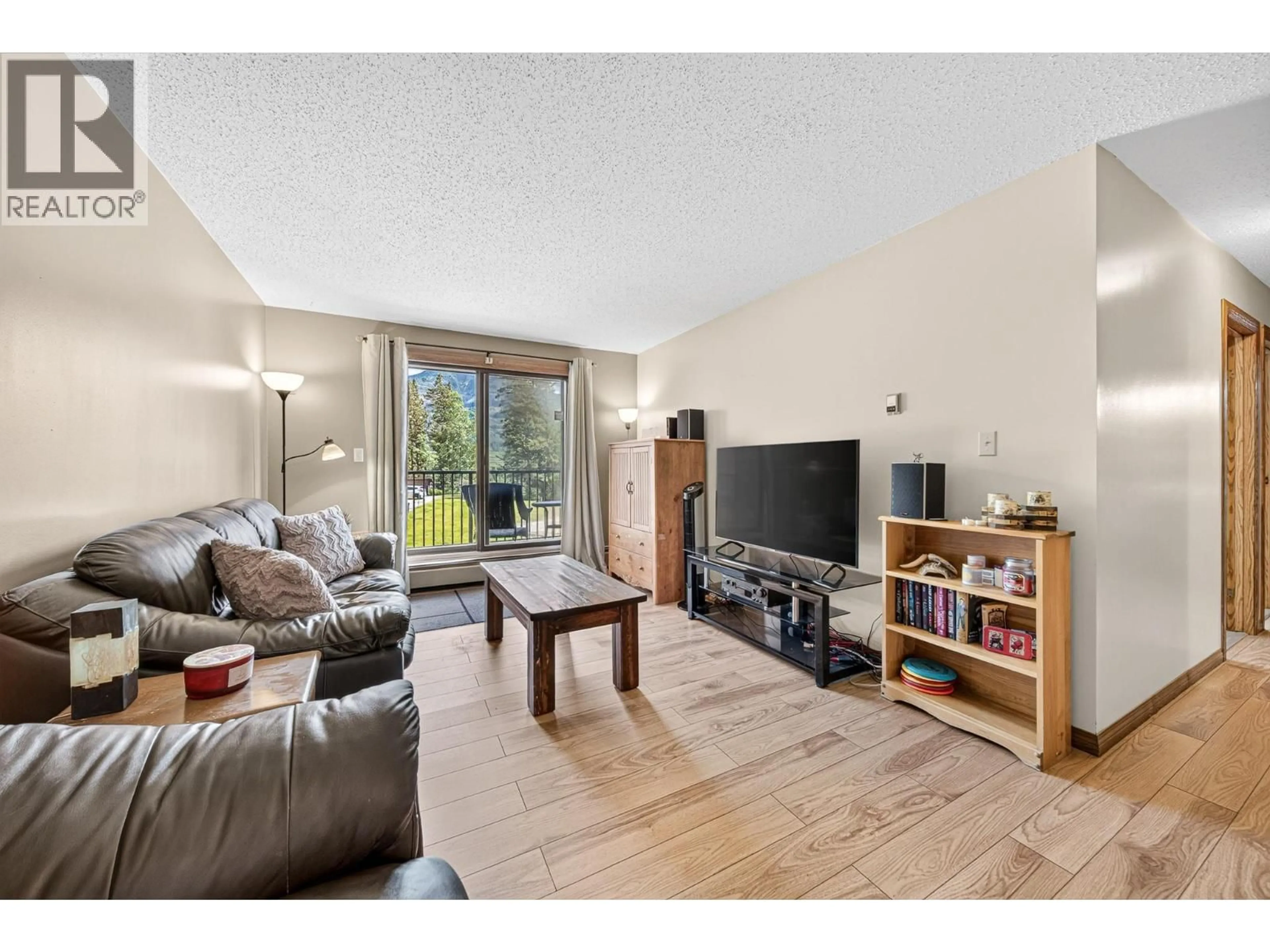 Living room with furniture, wood/laminate floor for 416 D-1286 PONDEROSA DRIVE, Sparwood British Columbia V0B2G2