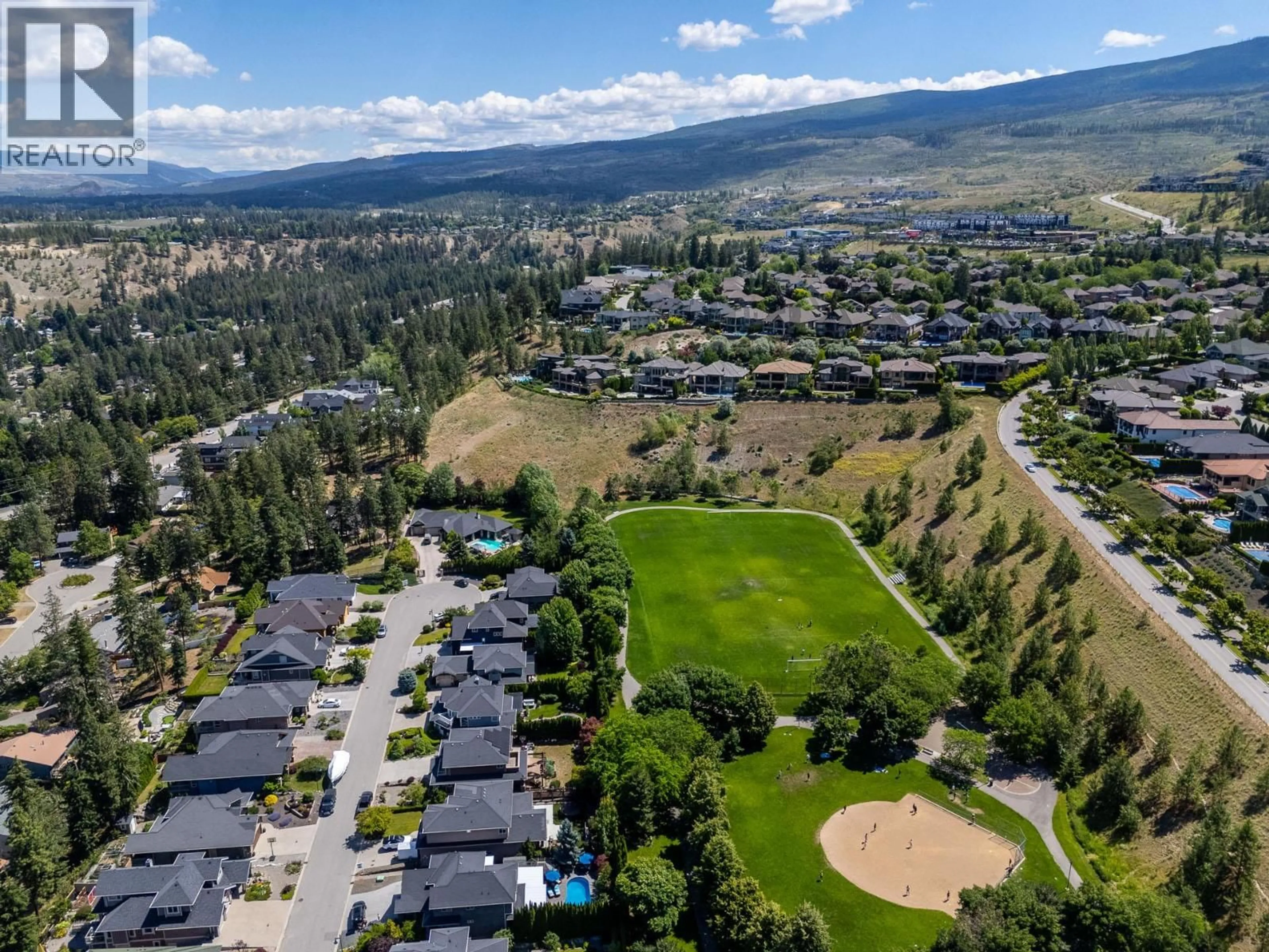 A pic from outside/outdoor area/front of a property/back of a property/a pic from drone, mountain view for 673 QUARRY AVENUE, Kelowna British Columbia V1W5E2