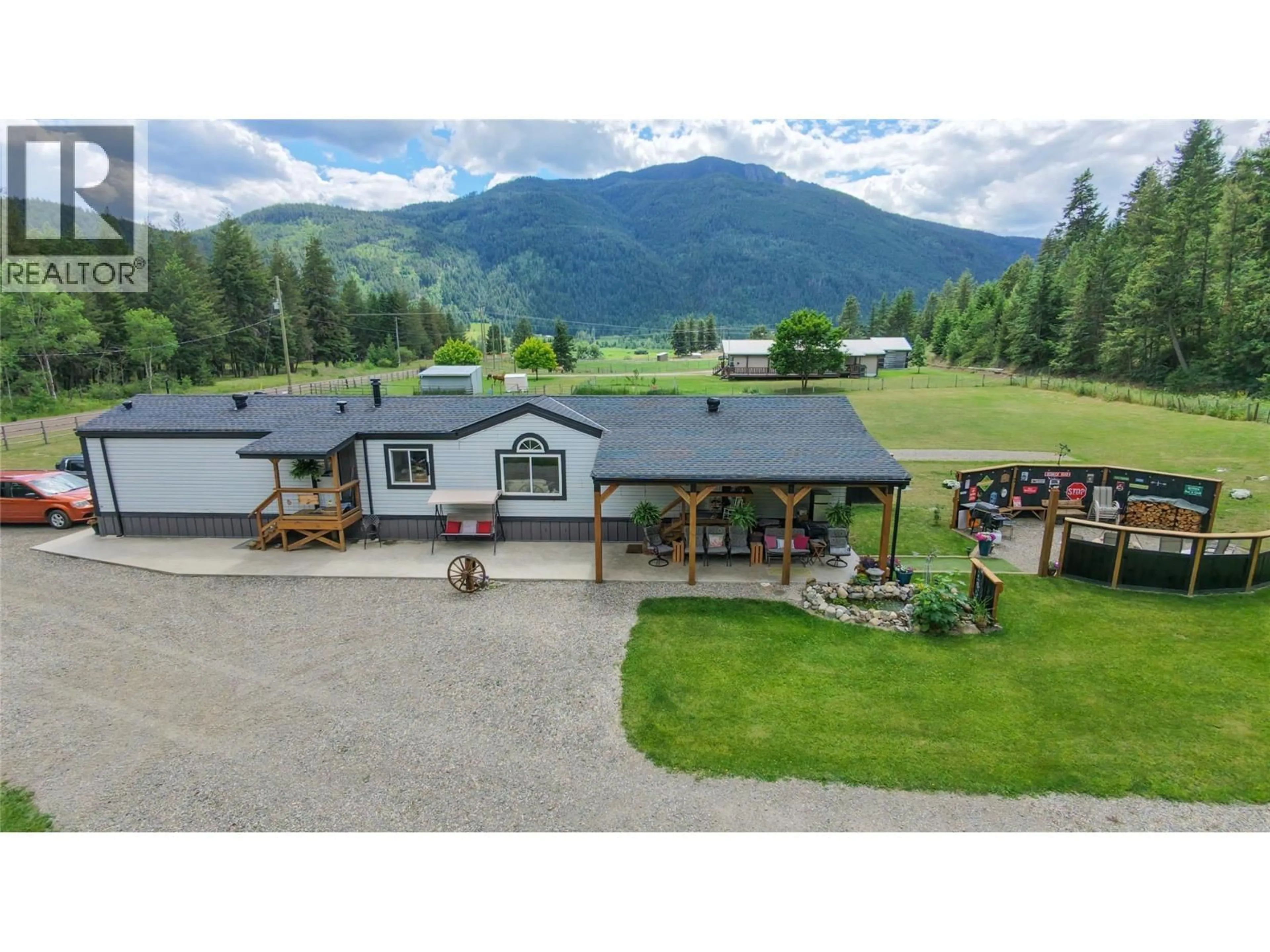 A pic from outside/outdoor area/front of a property/back of a property/a pic from drone, mountain view for 2884 WETASKIWIN ROAD, Falkland British Columbia V0E1W1