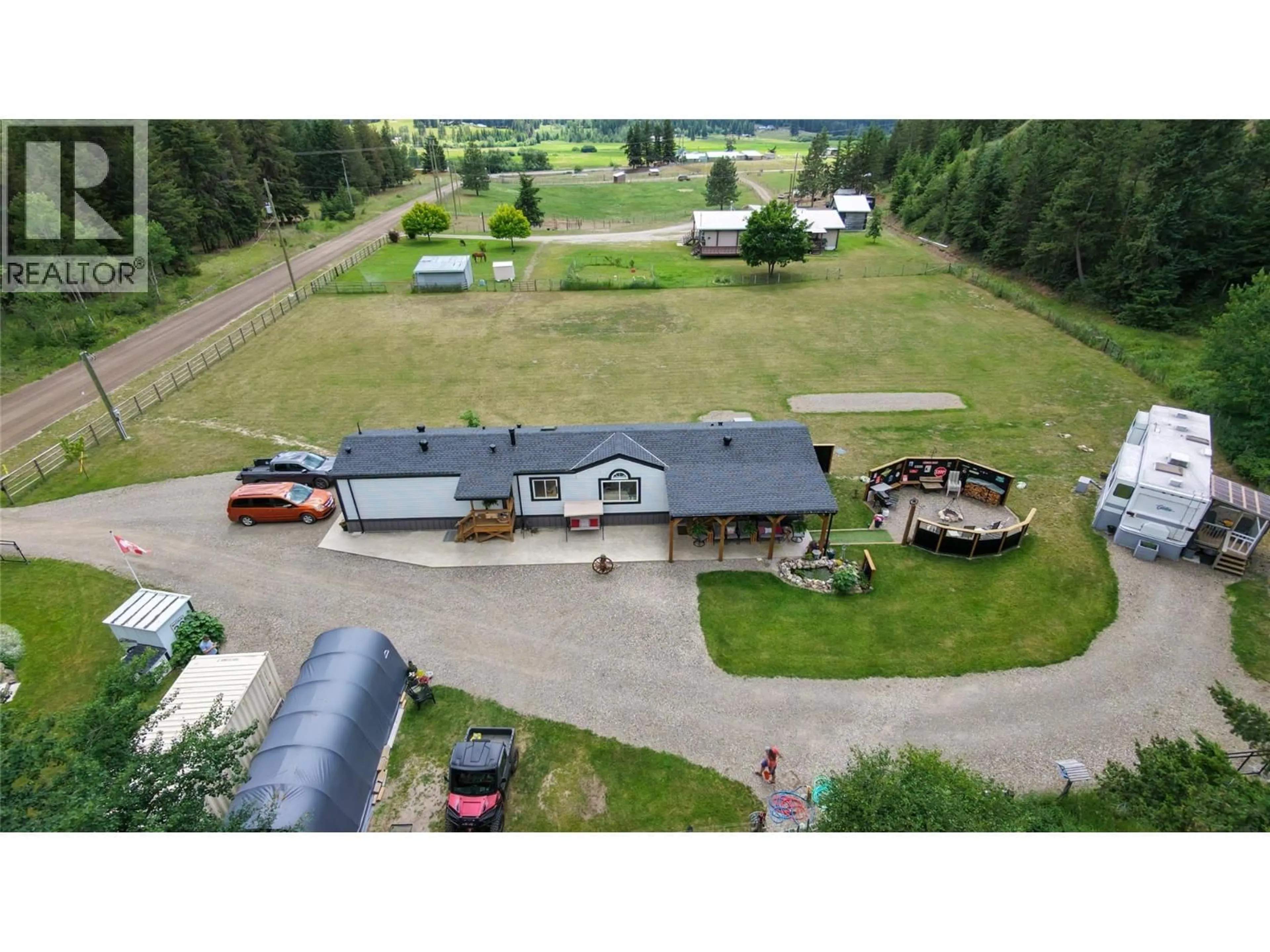 A pic from outside/outdoor area/front of a property/back of a property/a pic from drone, mountain view for 2884 WETASKIWIN ROAD, Falkland British Columbia V0E1W1