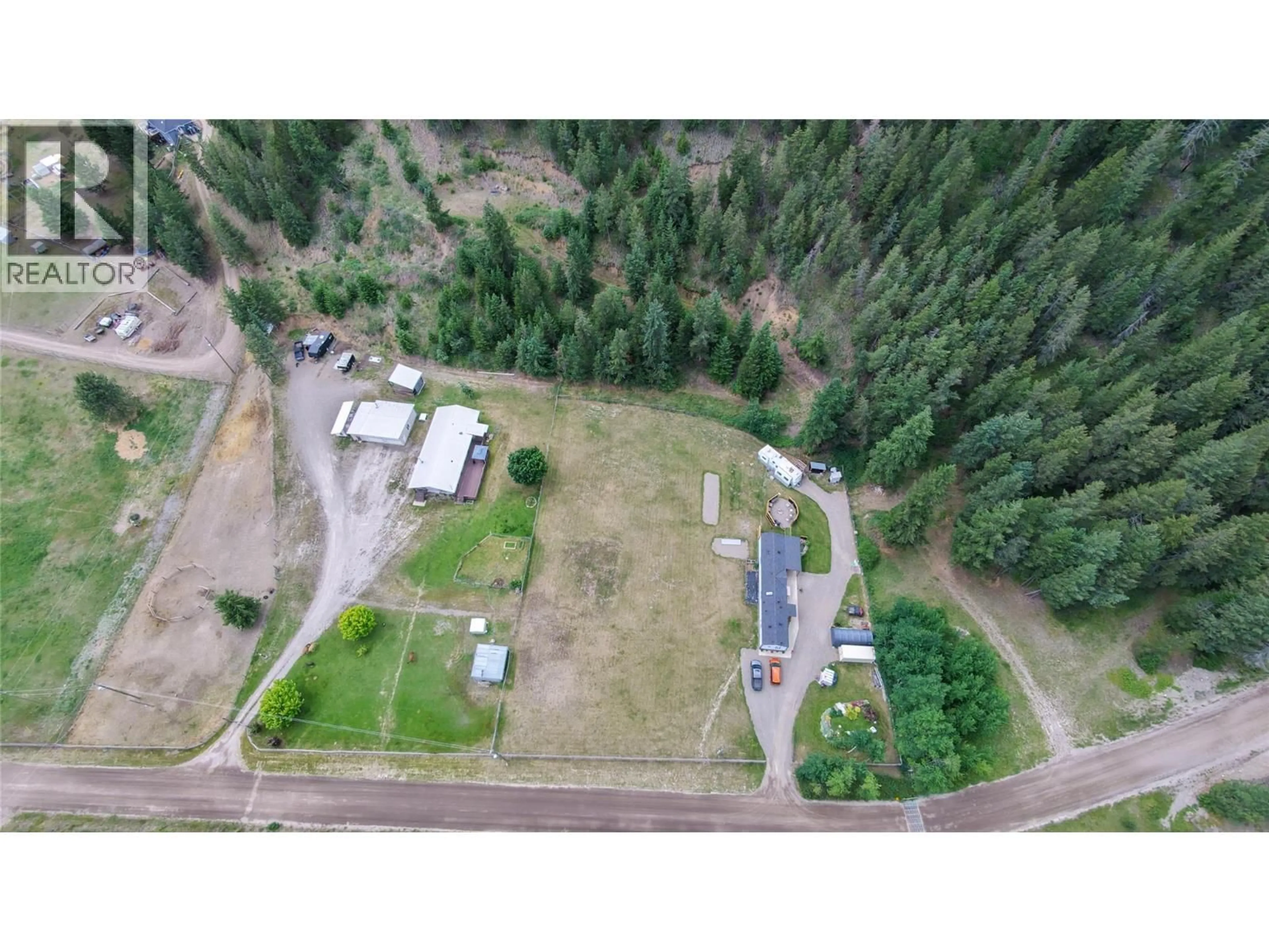 A pic from outside/outdoor area/front of a property/back of a property/a pic from drone, forest/trees view for 2884 WETASKIWIN ROAD, Falkland British Columbia V0E1W1