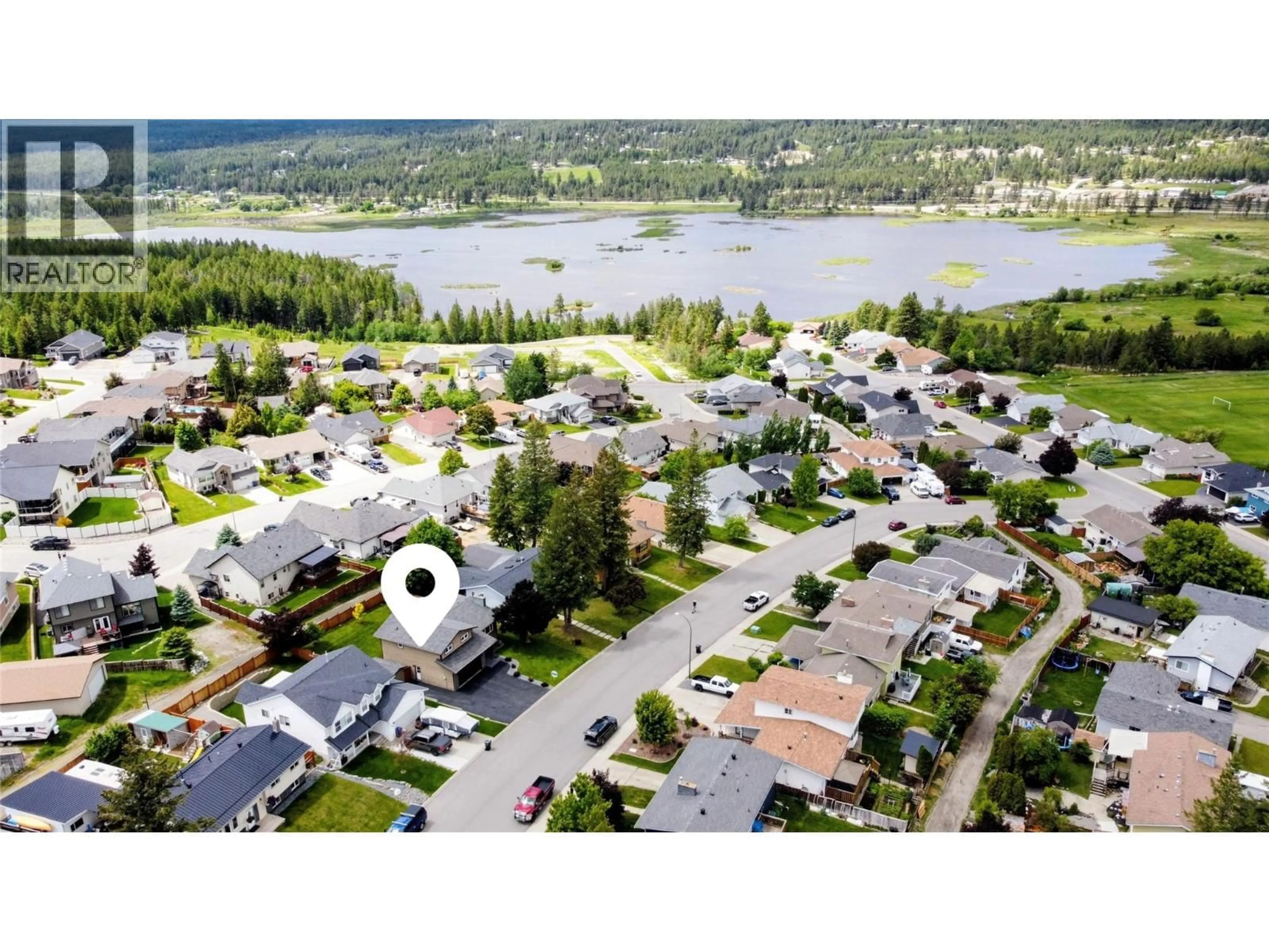 A pic from outside/outdoor area/front of a property/back of a property/a pic from drone, water/lake/river/ocean view for 201 BIRCH DRIVE, Cranbrook British Columbia V1C5X9