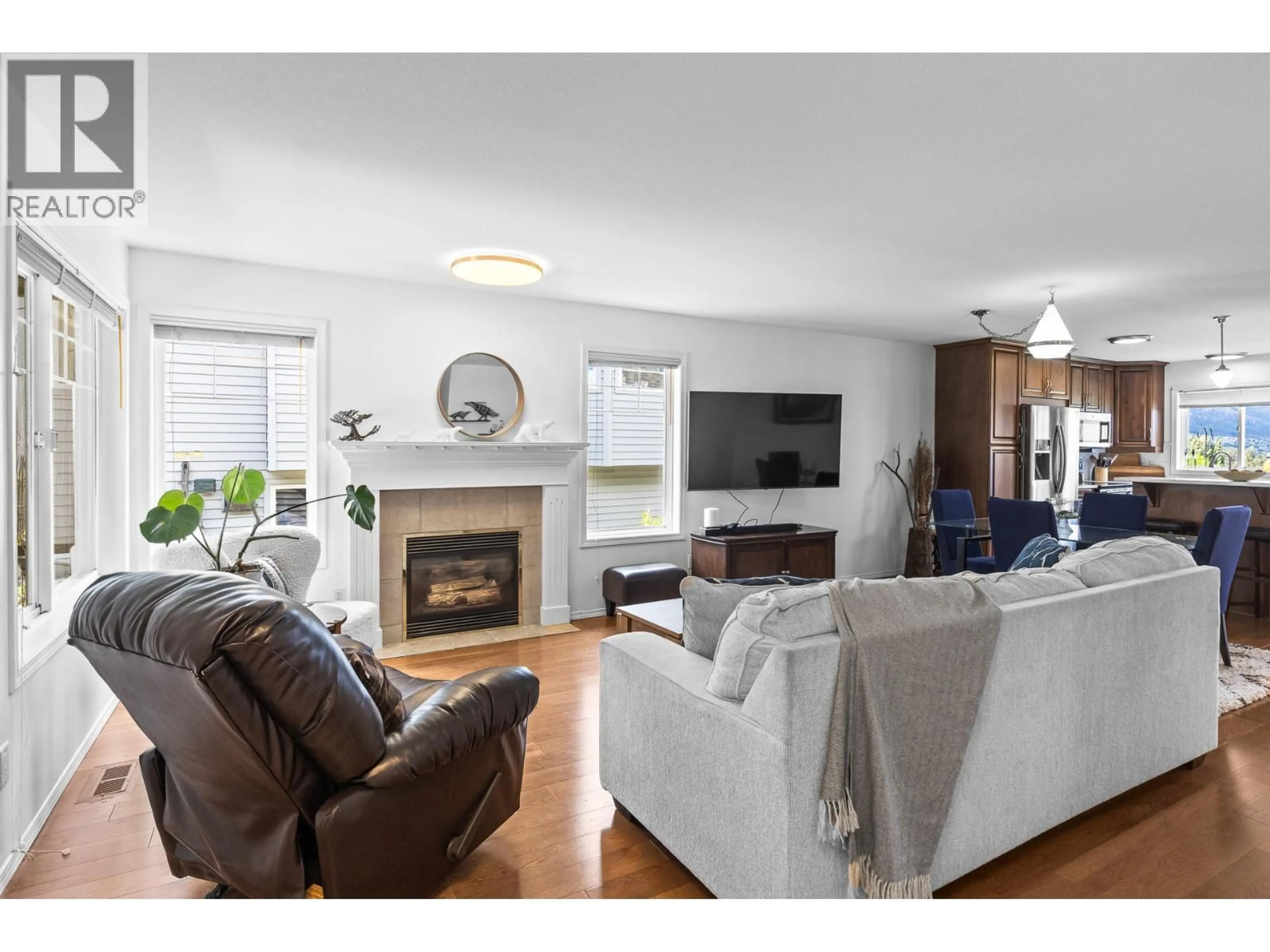Living room with furniture, wood/laminate floor for 3669 YORKTON ROAD, West Kelowna British Columbia V4T3T7
