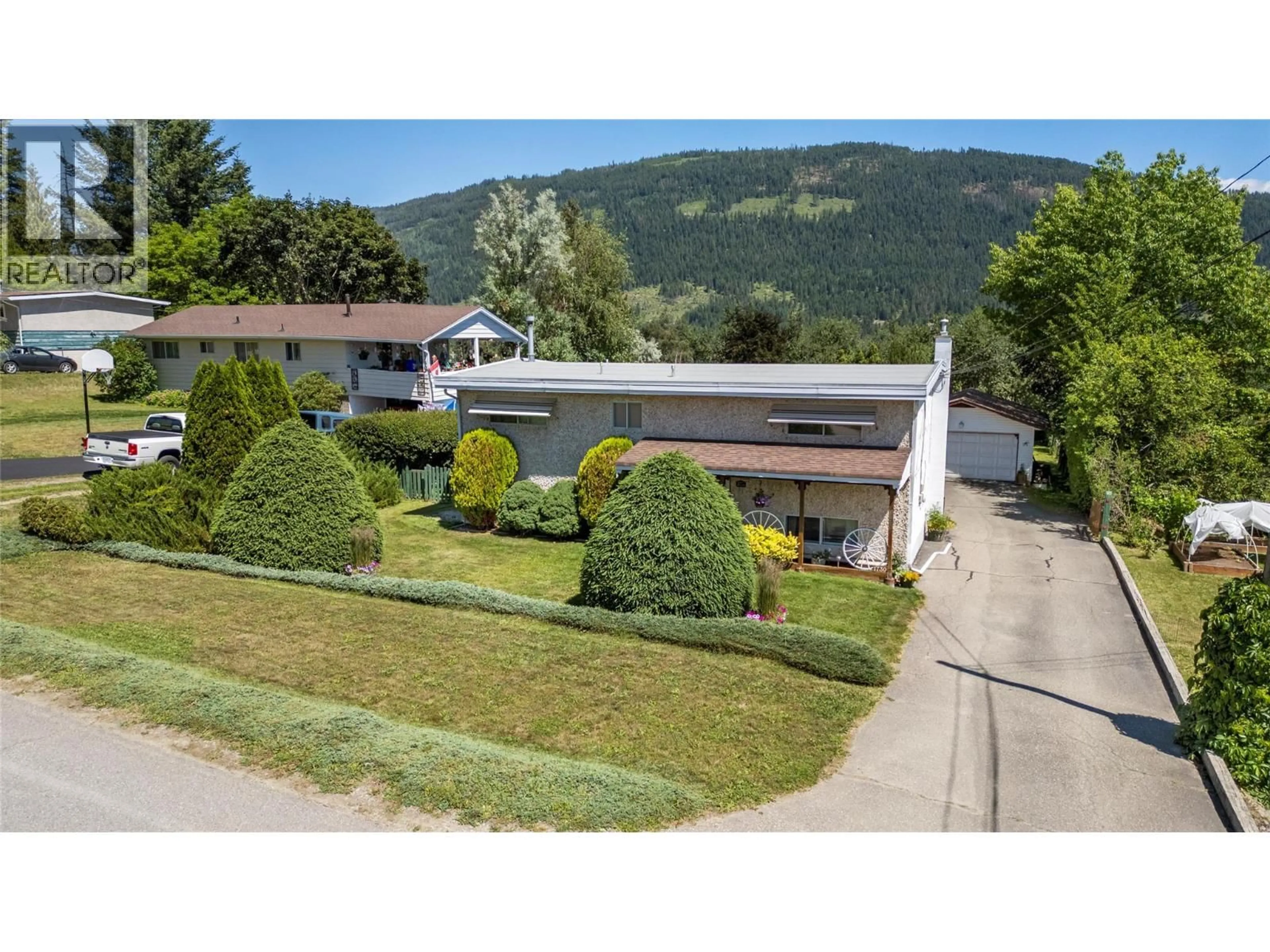 A pic from outside/outdoor area/front of a property/back of a property/a pic from drone, mountain view for 1730 36 STREET NORTHEAST, Salmon Arm British Columbia V1E2Z1