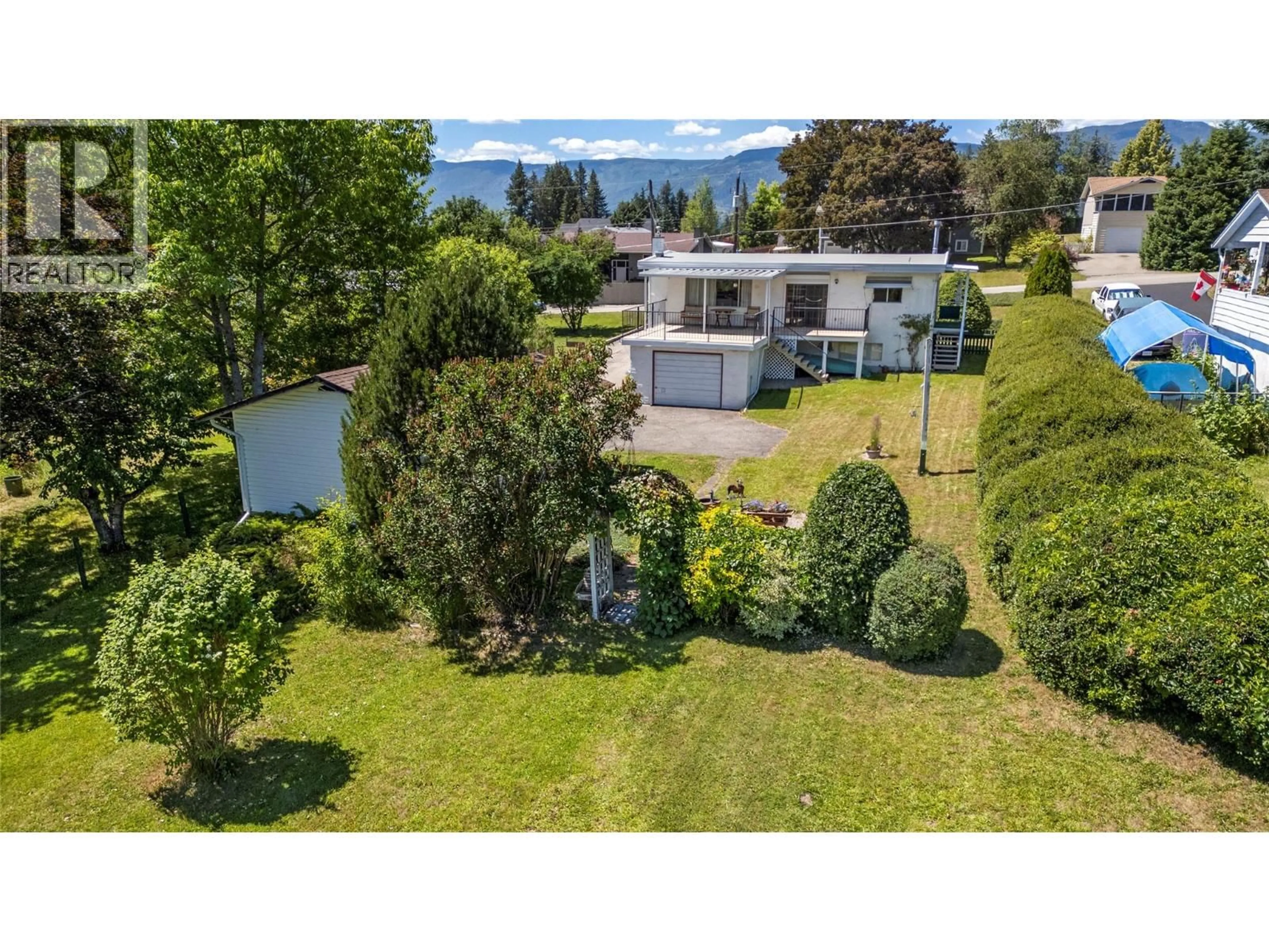 A pic from outside/outdoor area/front of a property/back of a property/a pic from drone, mountain view for 1730 36 STREET NORTHEAST, Salmon Arm British Columbia V1E2Z1