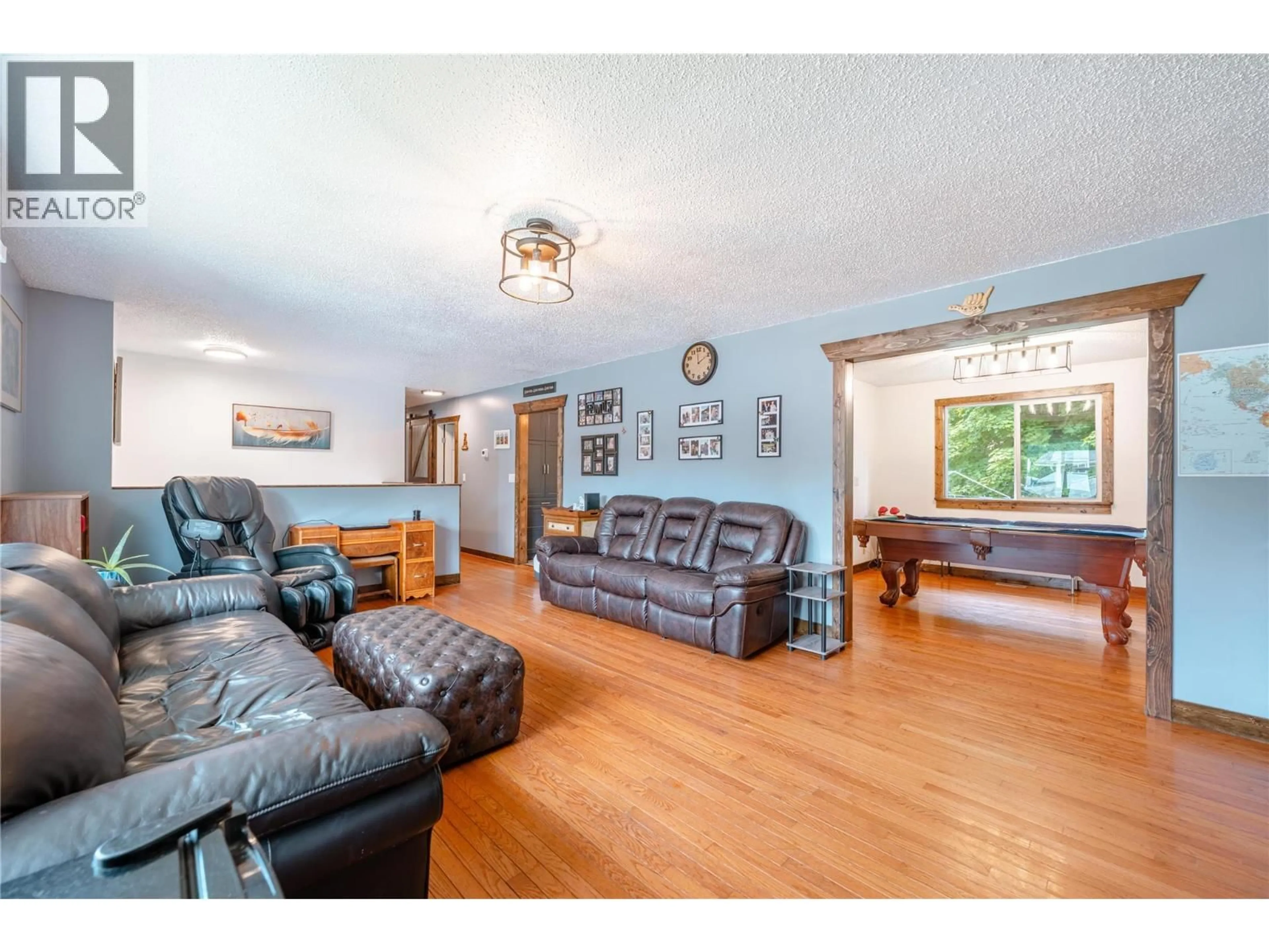 Living room with furniture, wood/laminate floor for 162 PEARKES DRIVE, Revelstoke British Columbia V0E2S0