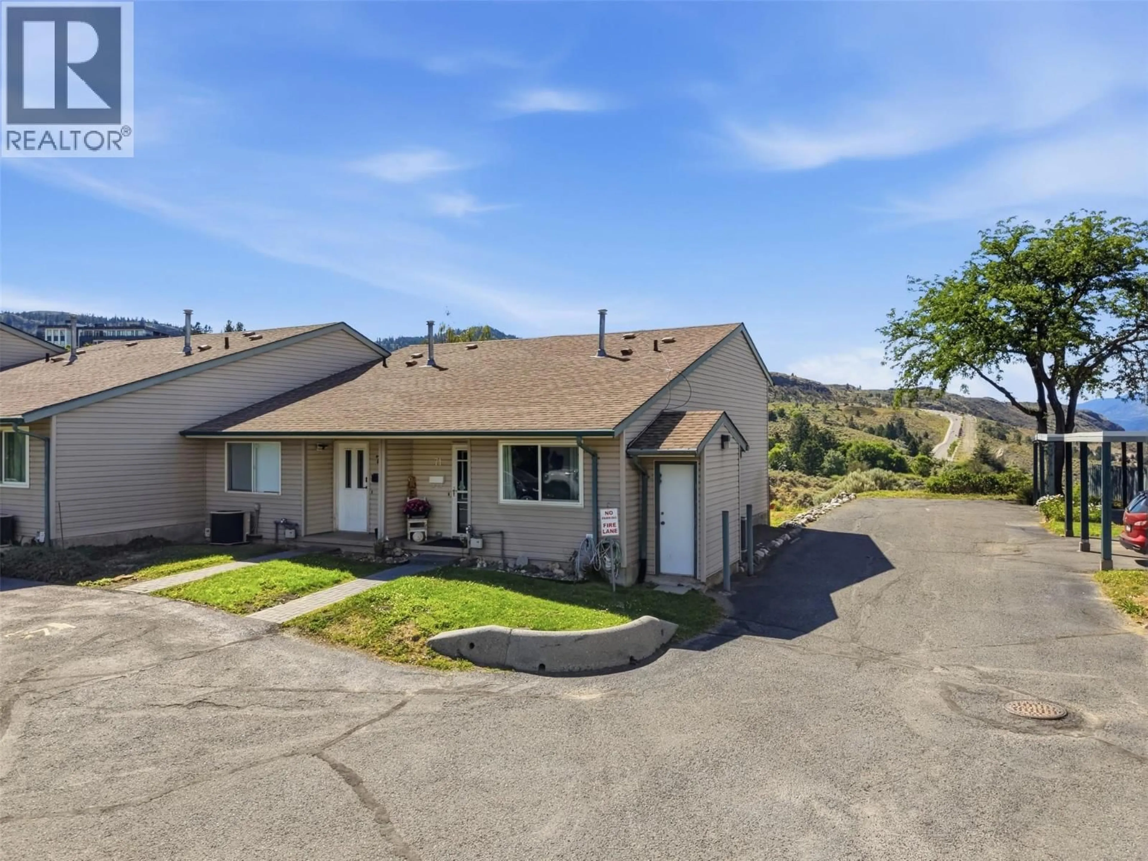 A pic from outside/outdoor area/front of a property/back of a property/a pic from drone, street for 71 - 580 DALGLEISH DRIVE, Kamloops British Columbia V2C5W7