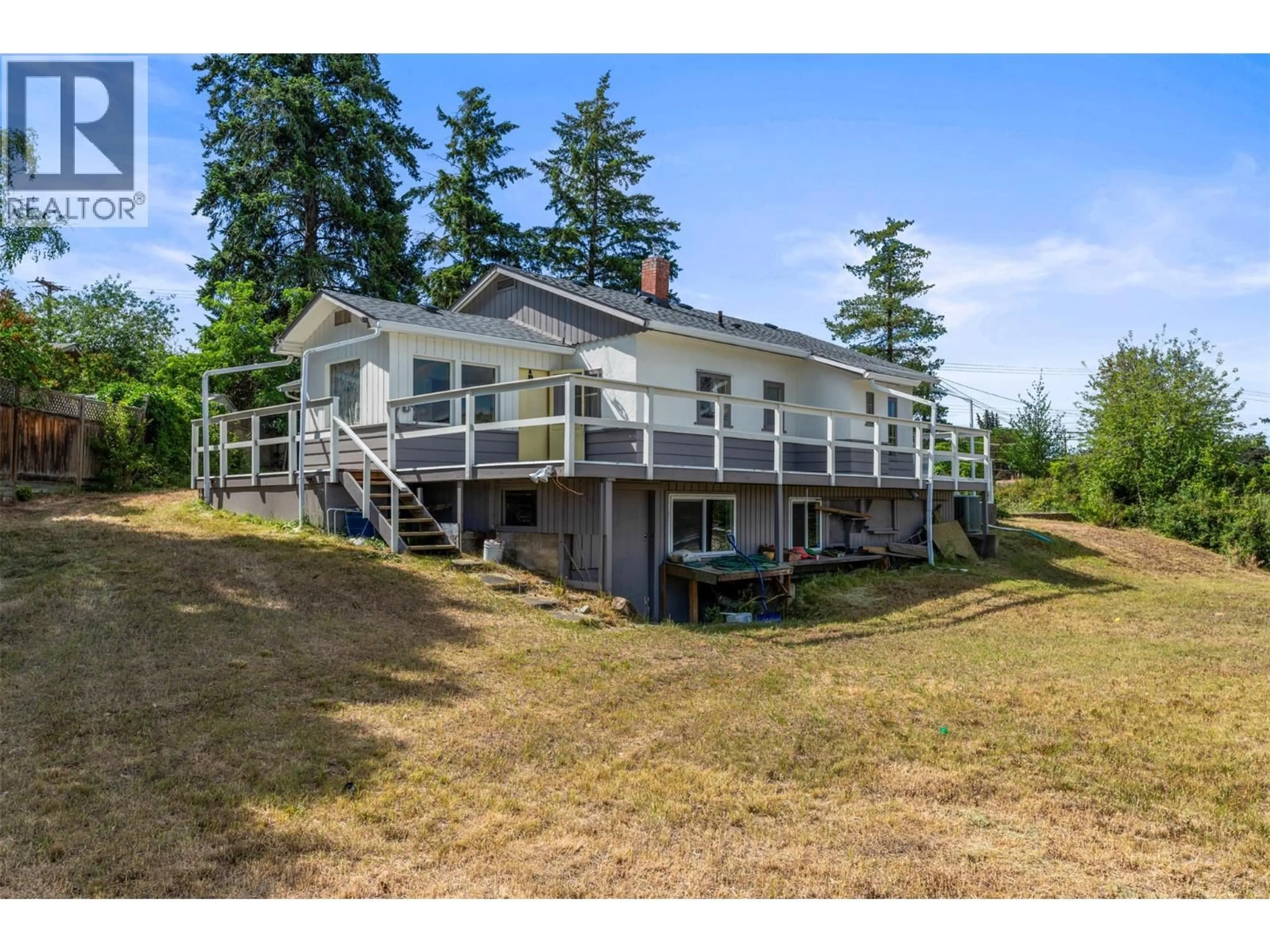 A pic from outside/outdoor area/front of a property/back of a property/a pic from drone, water/lake/river/ocean view for 1801 39 AVENUE, Vernon British Columbia V1T3A6