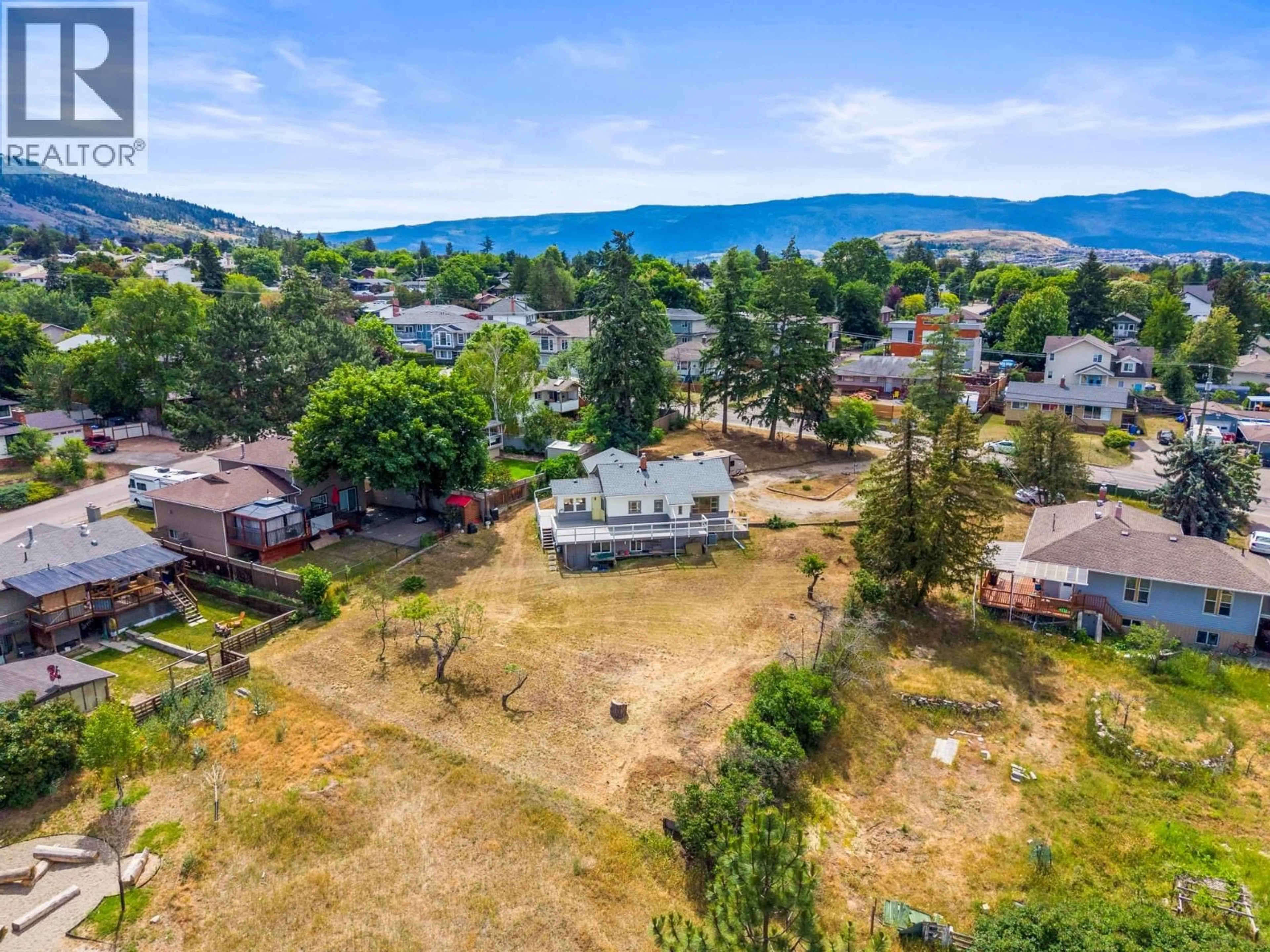 A pic from outside/outdoor area/front of a property/back of a property/a pic from drone, mountain view for 1801 39 AVENUE, Vernon British Columbia V1T3A6