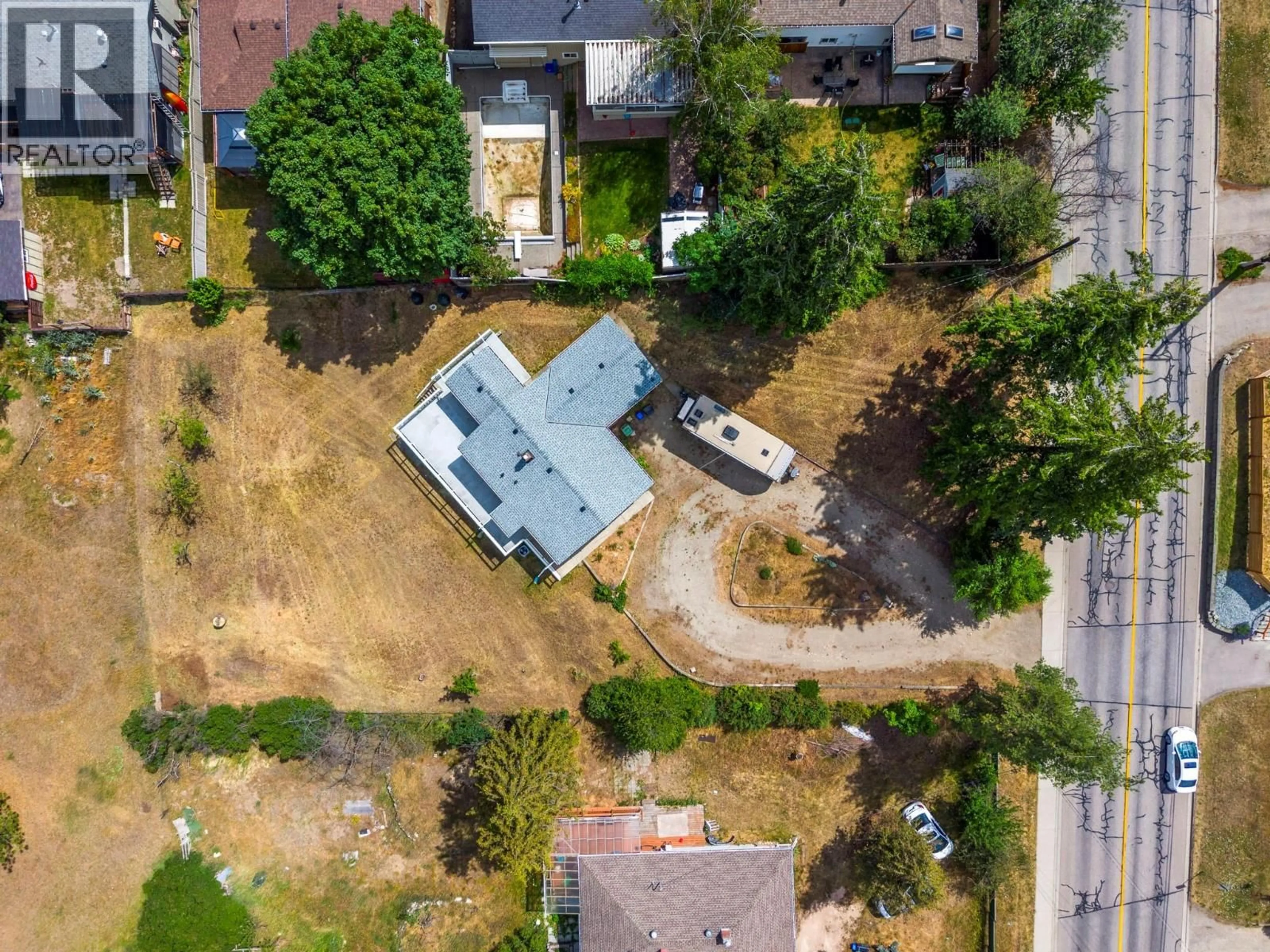A pic from outside/outdoor area/front of a property/back of a property/a pic from drone, street for 1801 39 AVENUE, Vernon British Columbia V1T3A6