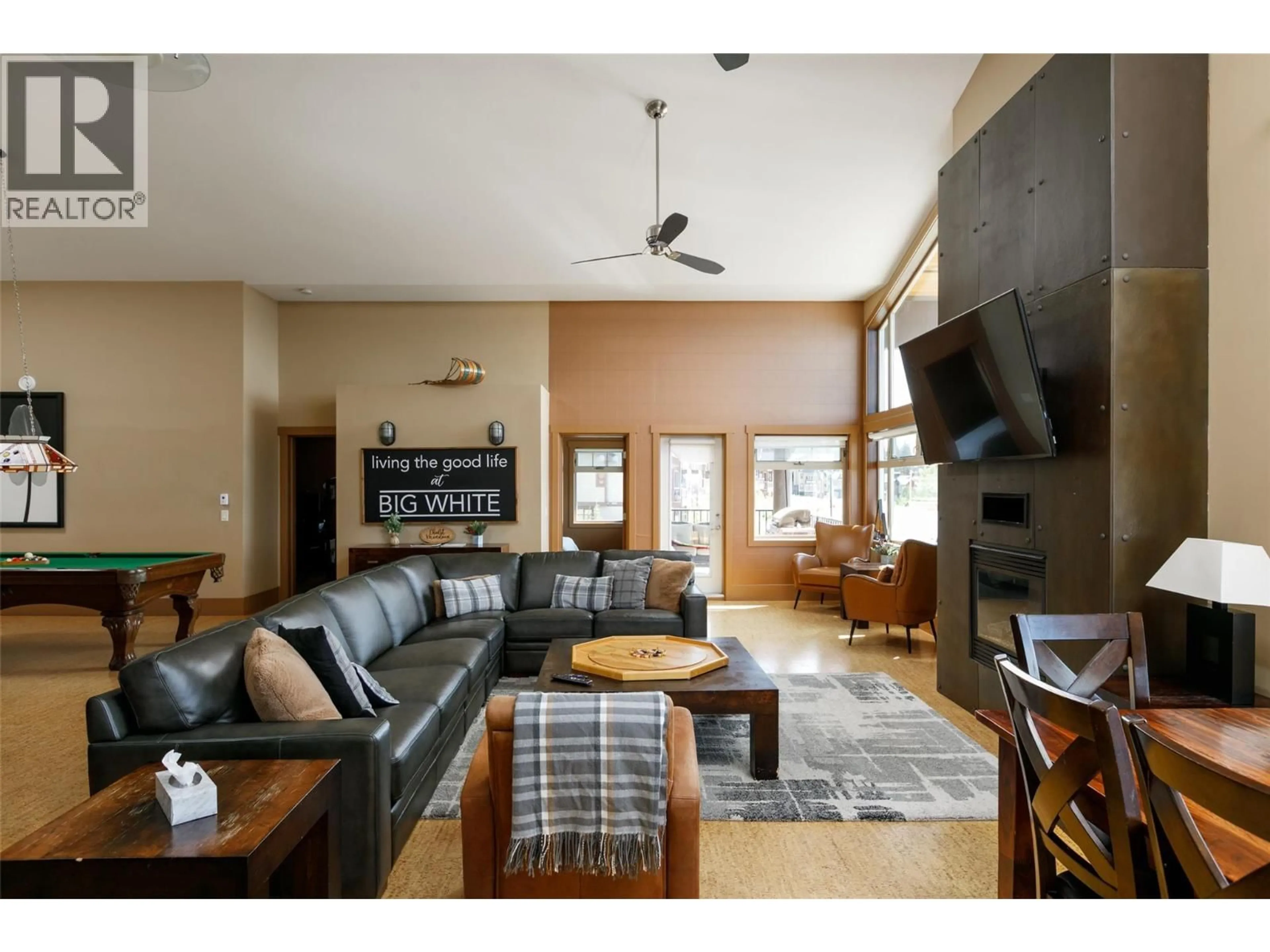 Living room with furniture, wood/laminate floor for 405 - 5030 SNOWBIRD WAY, Big White British Columbia V1P1P3