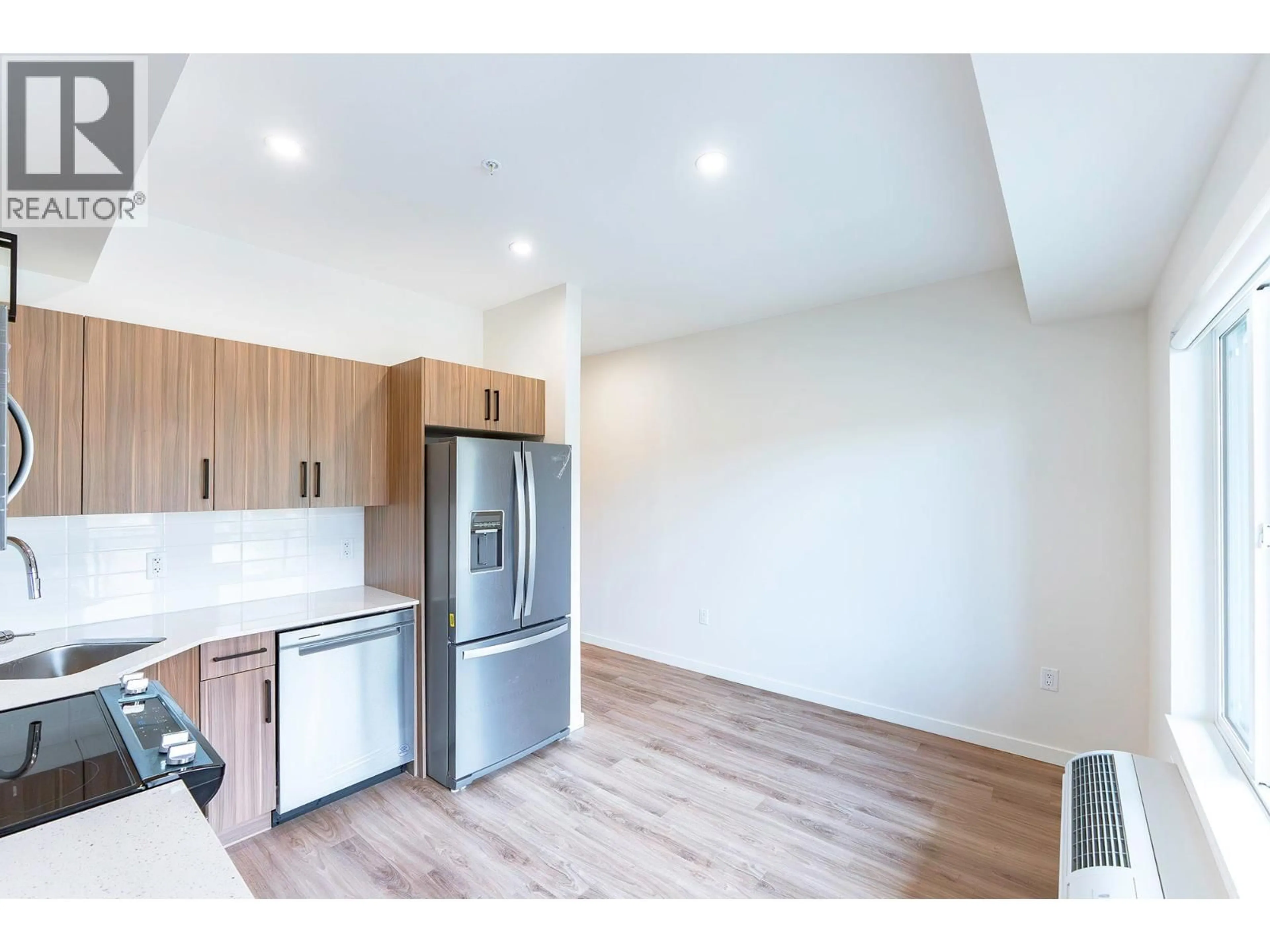 Open concept kitchen, wood/laminate floor for 309 - 2345 BUTT ROAD, West Kelowna British Columbia V4T1N6