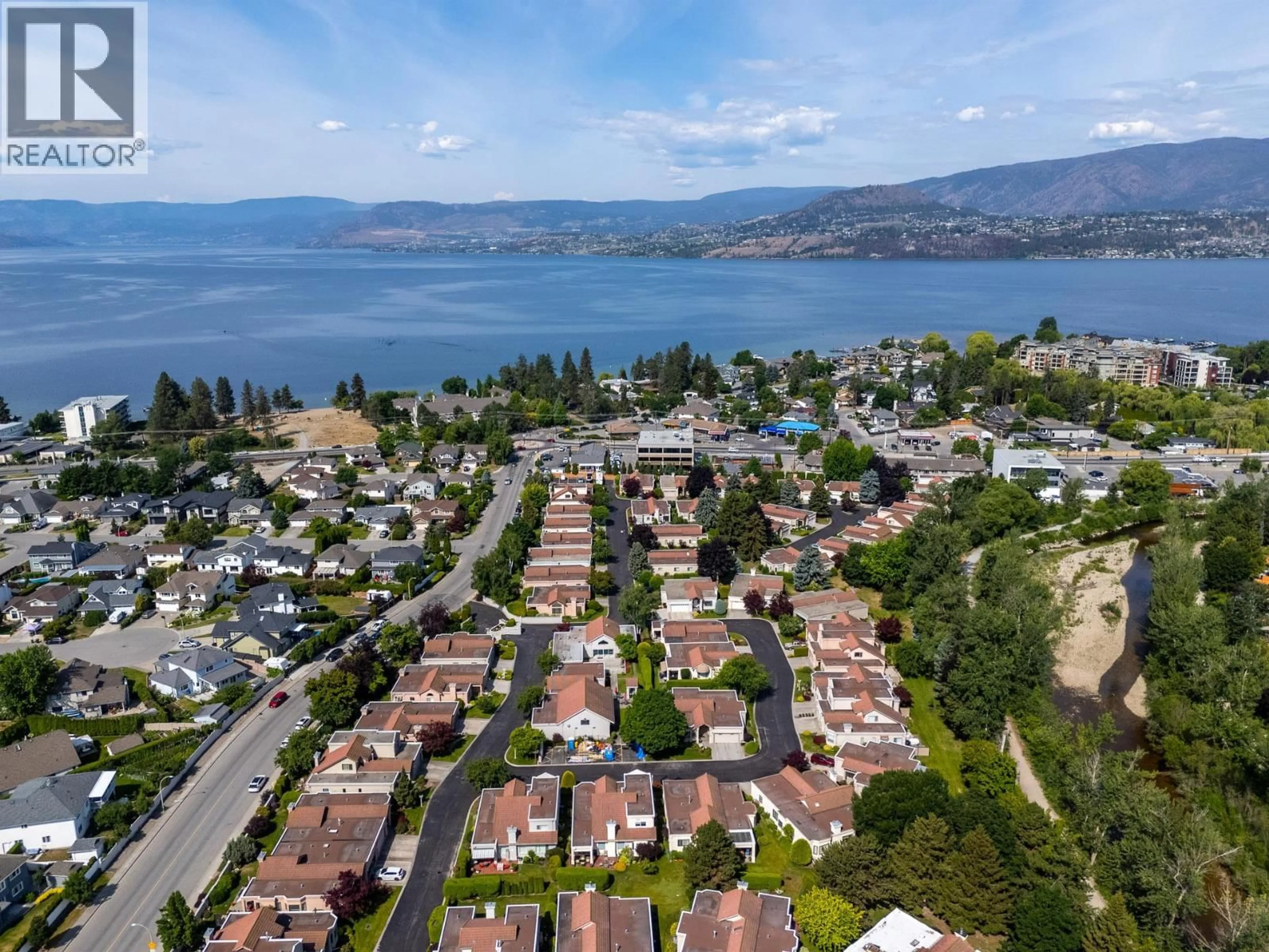 A pic from outside/outdoor area/front of a property/back of a property/a pic from drone, water/lake/river/ocean view for 111 - 650 LEXINGTON DRIVE, Kelowna British Columbia V1W3B6