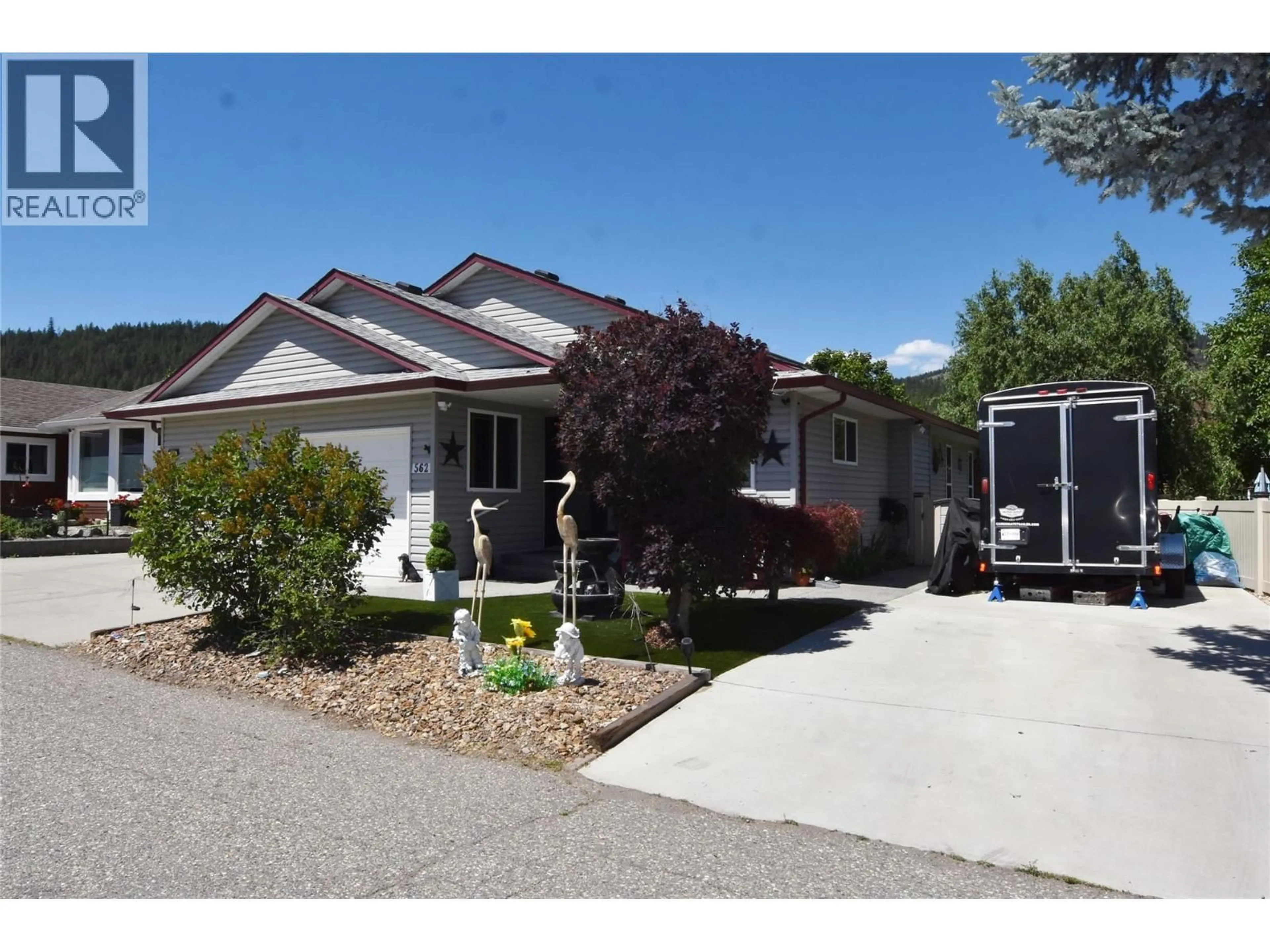 Home with vinyl exterior material, street for 562 MEADOWLARK AVENUE, Vernon British Columbia V1H2A1