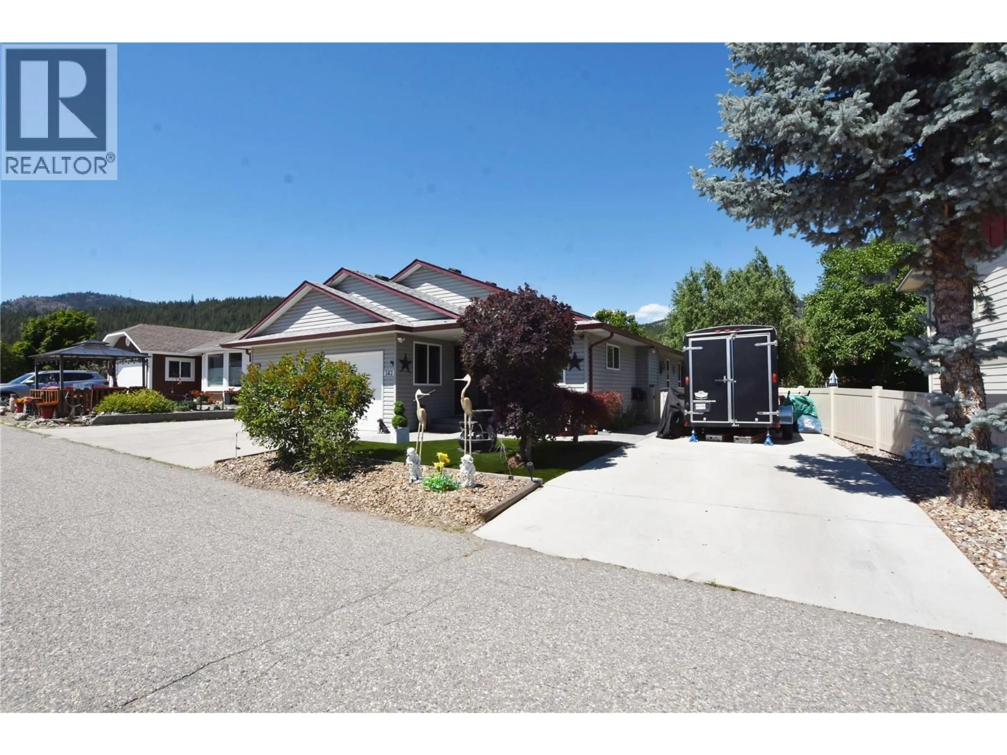Home with vinyl exterior material, street for 562 MEADOWLARK AVENUE, Vernon British Columbia V1H2A1