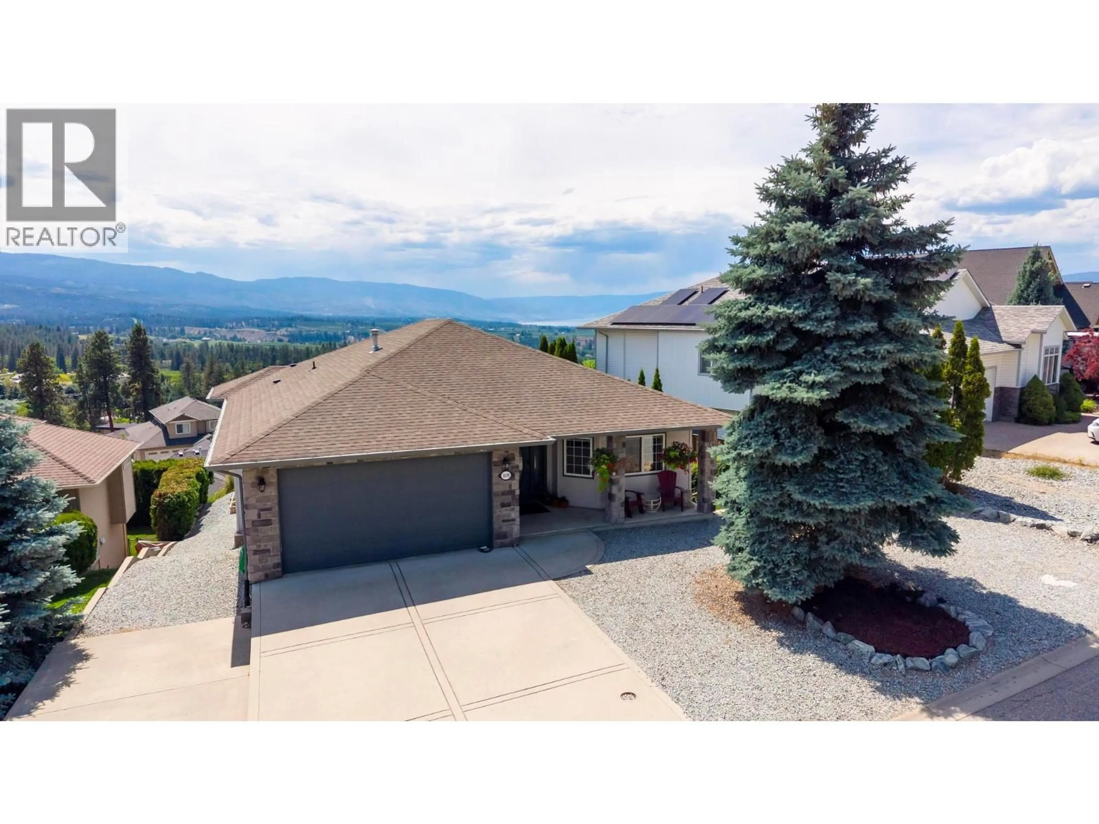 A pic from outside/outdoor area/front of a property/back of a property/a pic from drone, mountain view for 1499 WILMOT AVENUE, Kelowna British Columbia V1P1N3