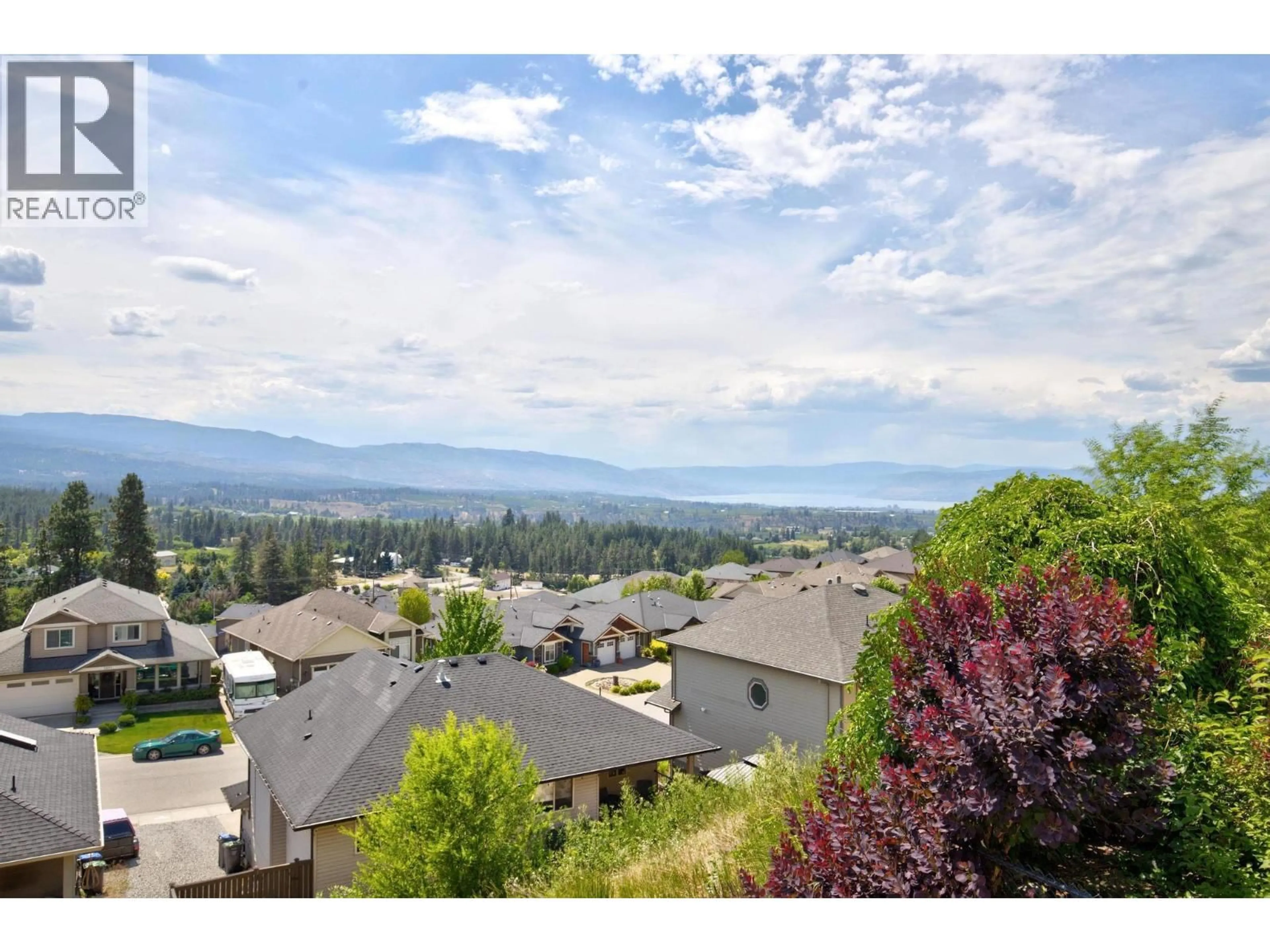 A pic from outside/outdoor area/front of a property/back of a property/a pic from drone, mountain view for 1499 WILMOT AVENUE, Kelowna British Columbia V1P1N3