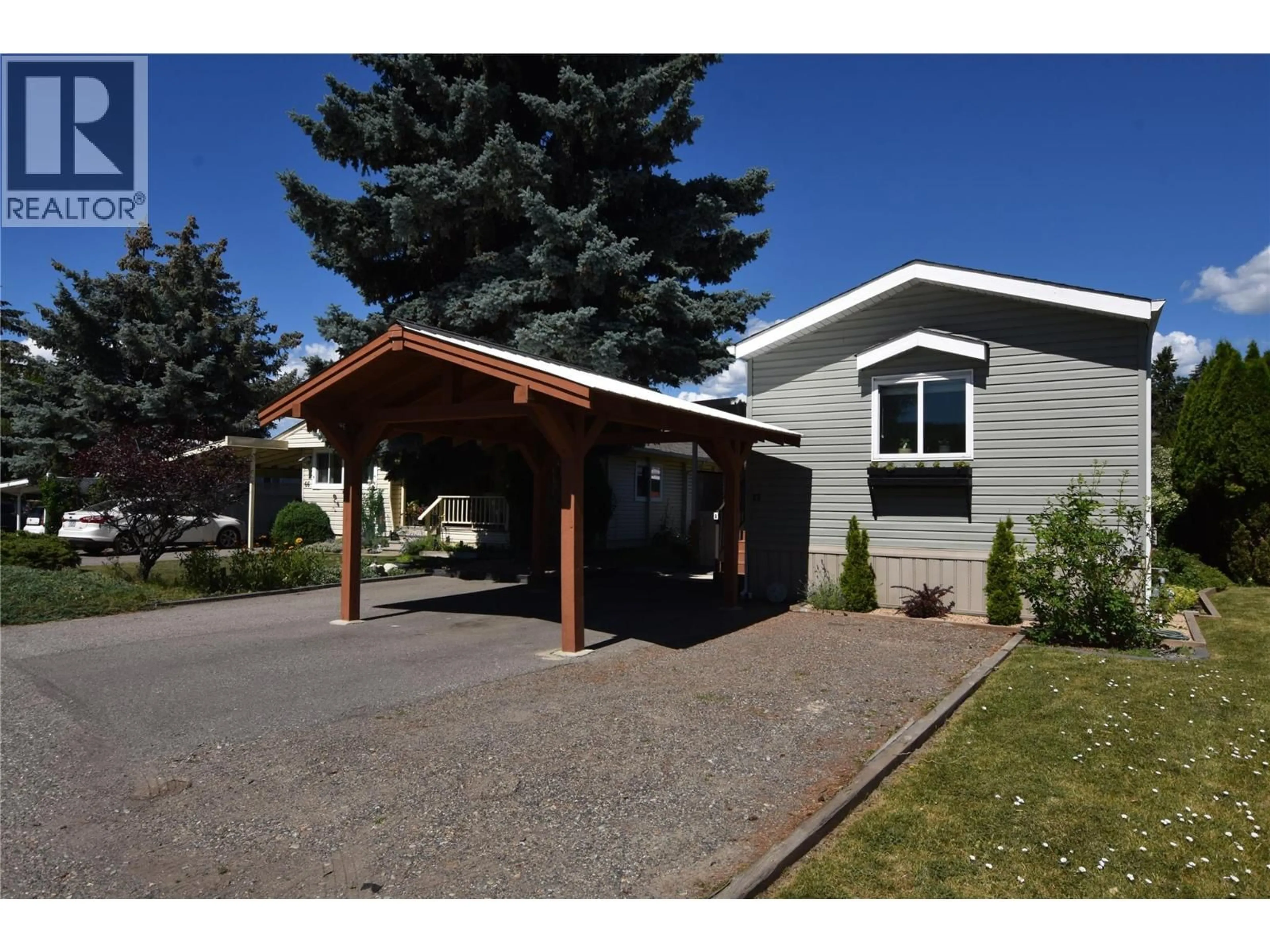 Home with vinyl exterior material, street for 65 - 5484 25 AVENUE, Vernon British Columbia V1T7A8